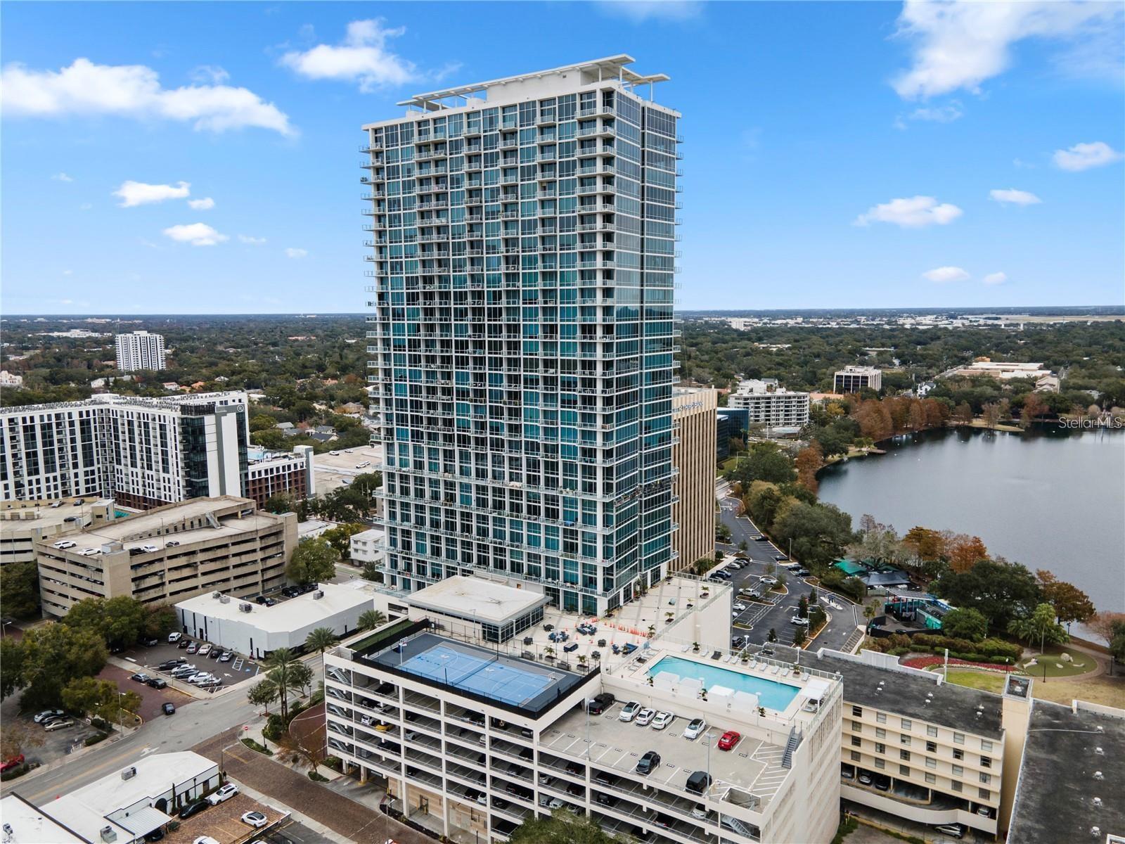 Welcome to ONE OF THE LARGER SIZE 2-story lofts, on the 10th floor, in the heart of downtown Orlando at the luxurious VUE at Lake Eola. With 1 bedroom, 1.5 baths, and soaring 27-foot ceilings, motorized roller shades, the space feels open and airy, highlighted by a stunning spiral staircase. The kitchen features sleek stainless steel appliances, a gas stove, and plenty of counter space, ideal for both cooking and entertaining. BRAND NEW HVAC TO BE INSTALLED PRIOR TO CLOSING! What makes this loft different from the rest? There is an oversized walk-in closet and in-unit laundry area with an extended storage area in the unit. The Private balcony offers sweeping views of the downtown skyline and Lake Eola. It’s the BEST VIEW AT THE VUE facing Lake Eola. Located in the center of it all, this loft gives you easy access to a vibrant urban lifestyle with a wide range of shopping, dining, and grocery options just a short walk away. Whether you’re grabbing coffee, enjoying a night out, or picking up groceries, everything you need is right at your doorstep. The building offers a wealth of luxury amenities including a 5,000 sq ft fitness center, 7th floor rooftop pool, basketball and tennis courts, and even an in-house movie theater. Valet parking, 24-hour security, and bio metric access to the amenities make life here even more convenient. Gas, water, sewage, and trash are included in the fee. This loft is more than just a home—it’s the perfect urban retreat in the heart of downtown Orlando. Easy to show - schedule a showing today!