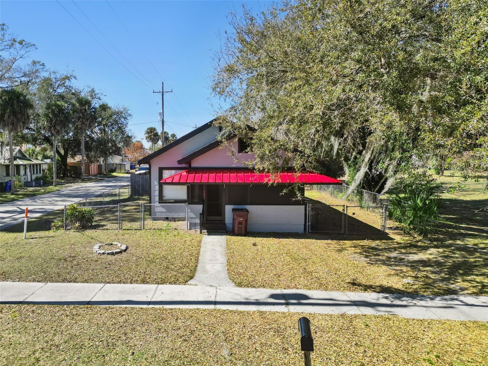 Unique opportunity in a prime location in historic downtown St. Cloud, Florida. This parcel is part of a four-parcel package deal on the New York Ave block of Irlo Bronson Pkwy/US192, right across from Veterans' Park and the Amphitheater, and across from the historic shopping district and City Hall. These four parcels are each 0.16 acres for a total of 0.64 contiguous acres. This location is zoned HB (Highway Business), with permitted uses of residential and commercial. This is an investment portfolio consisting of one vacant lot (0.16 acres) and three small income-producing homes that could be leased to individuals or small businesses, or developed into a commercial project. This package includes 1310 New York Ave, 1314 New York Ave, 0 New York Ave, and 1322 New York Ave. Also listed as a commercial property for sale, MLS# O6381462.