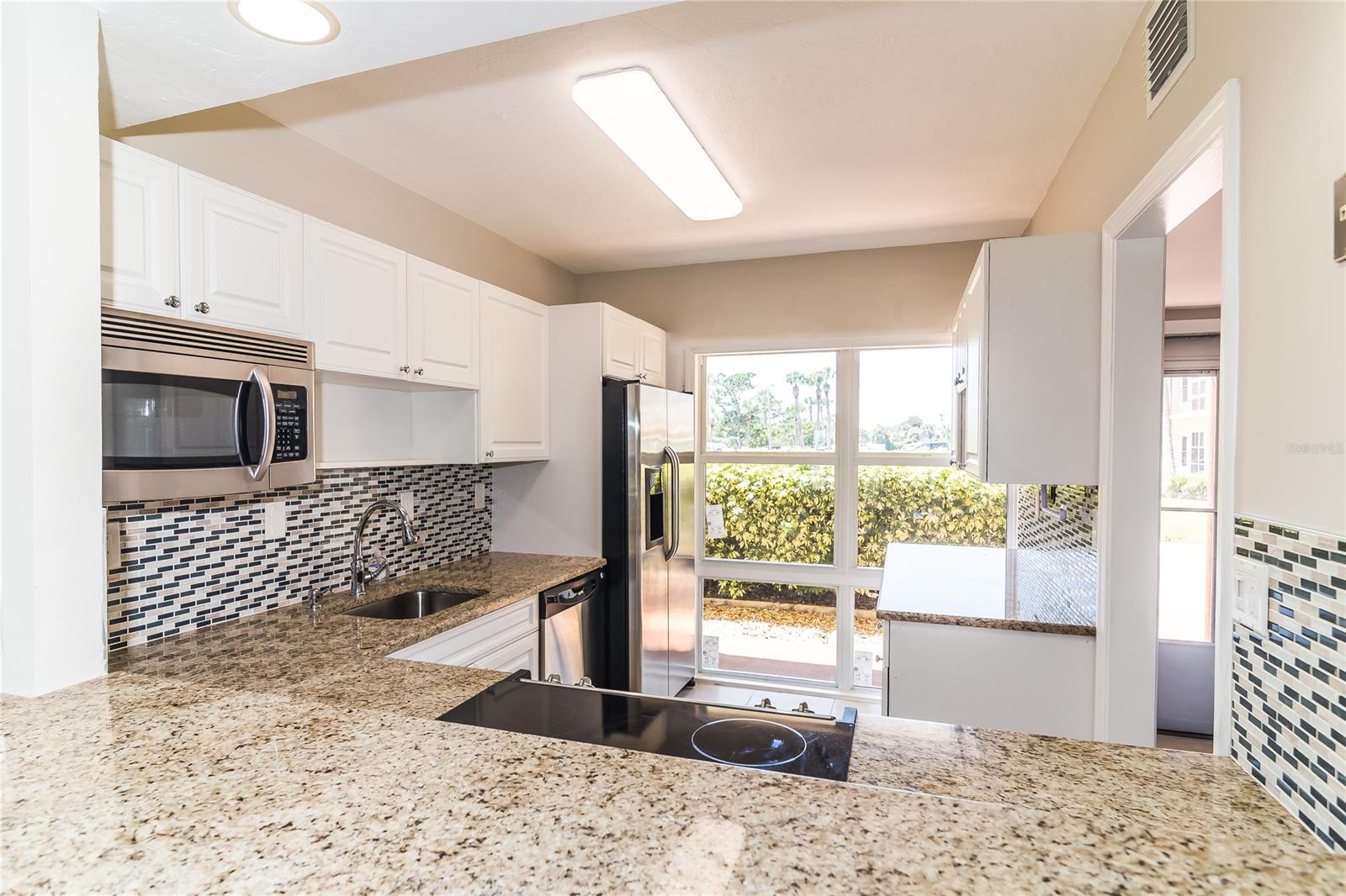 Beautiful quiet, safe, tucked away riverfront community. This tastefully remolded condo is ready for it's new owner!!! Large open floor plan boasting large floor tiles and NEW windows, sliding doors, kitchen cabinets, beautiful granite counters top and stainless appliances. This unit is located on the first floor with direct river views. The complex is equipped with first come first serve boat slips, kayak and canoe storage, bbq grills and picnic tables, well maintained and recently updated clubhouse, pool area and tennis courts! This place has it all!! Come check it out for yourself!! ;Water: City
