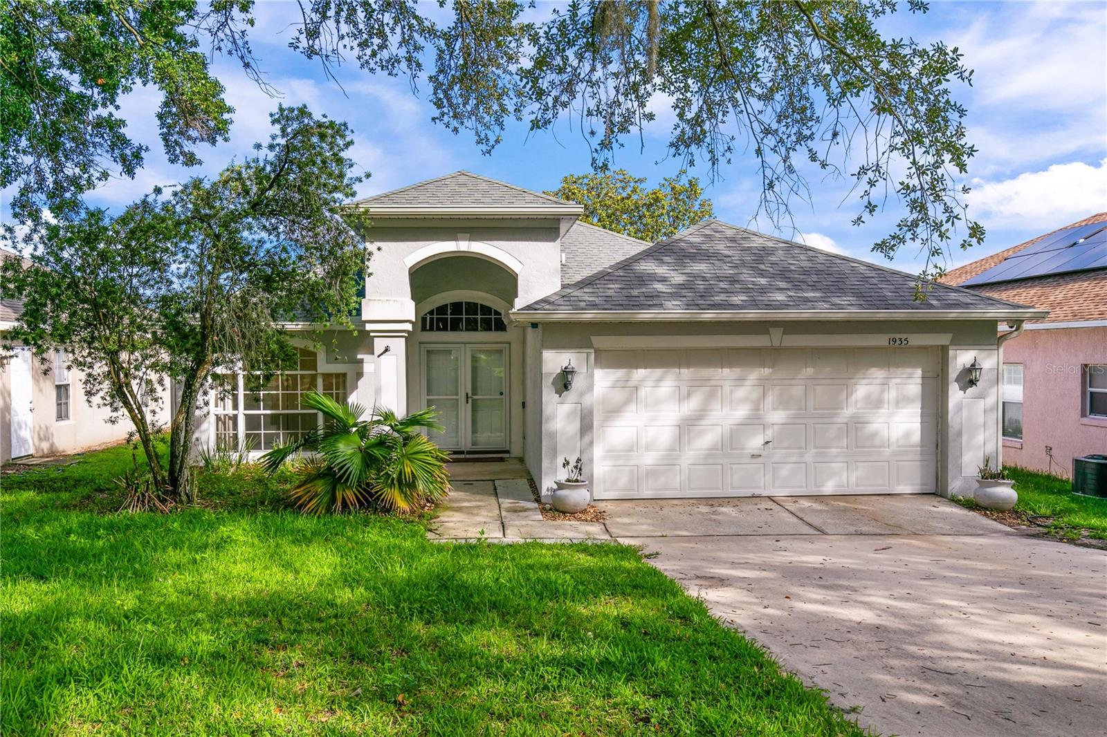 Welcome to this charming 3-bedroom, 2-bathroom home nestled in the highly desirable Abingdon Hill community. Offering nearly 1,600 square feet of thoughtfully designed living space, this home features soaring volume ceilings, an open-concept layout, and abundant natural light throughout. The spacious kitchen overlooks the family room and includes a breakfast bar, pantry, and ample cabinet and counter space—perfect for everyday living and entertaining. The split-bedroom floor plan provides added privacy, while the primary suite offers a walk-in closet, dual vanities, and a separate tub and shower. Step outside to enjoy peaceful pond views from the screened lanai, creating the perfect setting for morning coffee or evening relaxation. Additional highlights include a two-car garage, interior laundry hookups, and a low-maintenance lot. Conveniently located just minutes from shopping, dining, major highways, downtown Orlando, theme parks, and top employment centers, this home combines comfort, convenience, and an unbeatable location. Don’t miss your opportunity to own in one of MetroWest’s most established neighborhoods!