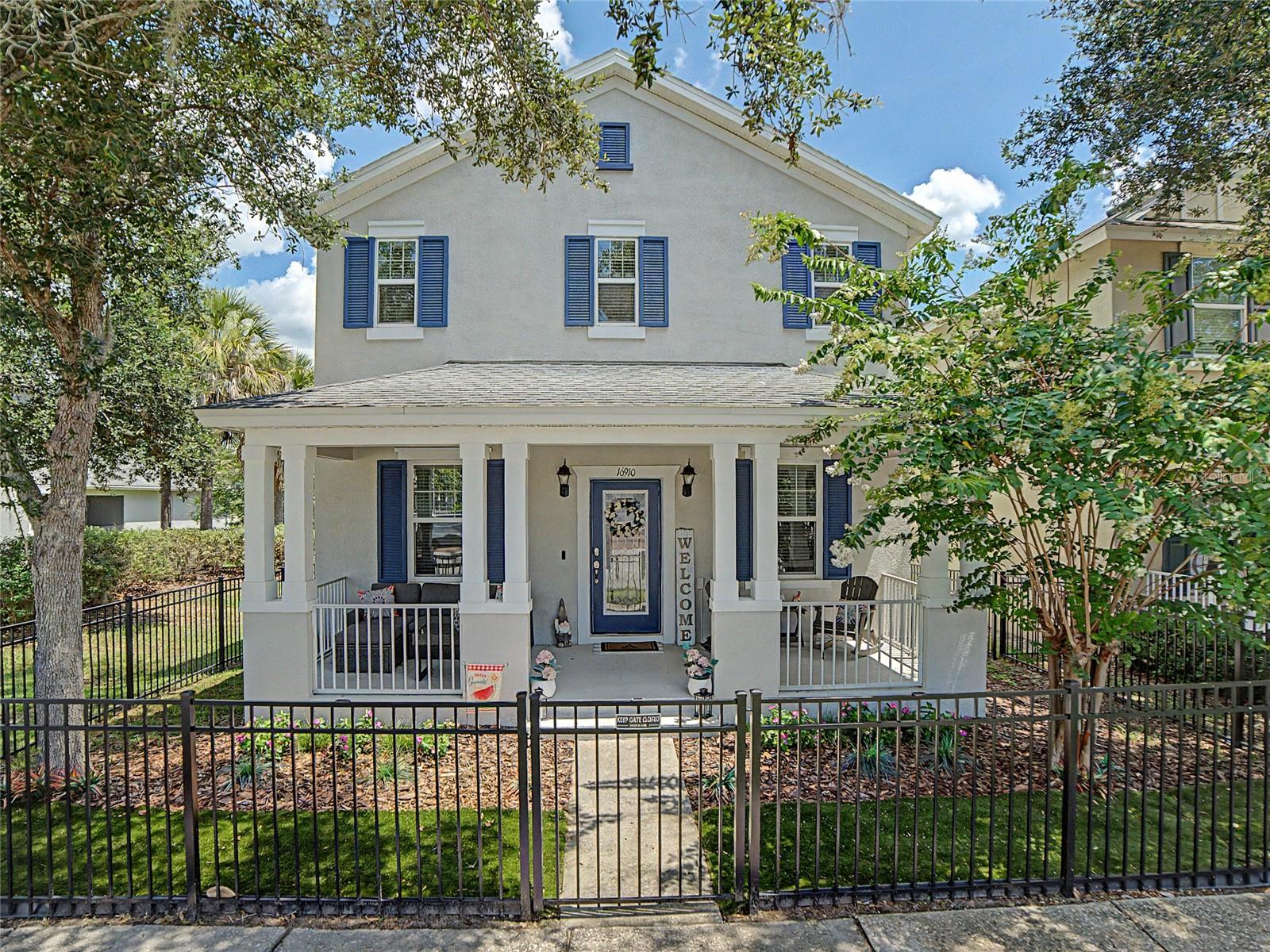 Timeless Southern Charm Meets Modern Luxury in FishHawk Ranch's Prestigious Garden District. Welcome to 16910 Dorman Road, an extraordinary residence where classic architecture, sophisticated updates, and an exceptional lifestyle come together in one of FishHawk Ranch's most sought-after neighborhoods. Perfectly positioned on a desirable homesite with guest parking and just steps from the vibrant Park Square, this stunning home offers nearly 2,600 square feet of beautifully designed living space, including a rare detached private studio suite with a full bath—an incredible opportunity for multigenerational living, a luxurious guest retreat, executive home office, fitness studio, media room. A welcoming full-width front porch and elegant wrought iron leaded glass entry door create unforgettable curb appeal, inviting you into a home filled with warmth, craftsmanship, and timeless design. Rich crown molding, designer lighting, ceramic tile flooring, and an abundance of natural light enhance the thoughtfully designed interior. The gourmet kitchen is the heart of the home, showcasing granite countertops, rich maple cabinetry with crown molding, stainless steel appliances, a glass tile backsplash, recessed lighting, a spacious center island with pendant lighting, breakfast bar seating, and generous prep space—all seamlessly opening to the expansive family room for effortless entertaining. A private office with French doors, elegant formal dining room, stylish powder bath with pedestal sink, and a beautifully appointed laundry room featuring custom maple cabinetry and decorative tile backsplash complete the main level. Upstairs, luxury wood-look flooring extends throughout the private living quarters. The spacious owner's retreat is a true sanctuary, offering an oversized walk-in closet and a spa-inspired bath featuring beautiful maple cabinetry, dual vanities, a relaxing garden tub with decorative listello tile accents, a separate walk-in shower enhanced with a premium massage shower system, and abundant storage. Two additional generously sized bedrooms share a beautifully appointed secondary bath, also appointed with matching maple cabinetry, while the detached studio suite includes its own full bath with coordinating maple cabinetry, creating a cohesive design throughout the home. Step outside to your private brick paver lanai designed for year-round Florida living. Relax in the hot tub, entertain with the natural gas grill and built-in pizza oven, or simply enjoy the peaceful outdoor setting. Additional premium upgrades include fresh interior paint, a newer HVAC system, new stainless steel kitchen appliances, a new LG all-in-one washer and dryer, EV charging station, and permanent Govee architectural soffit lighting, providing comfort, efficiency, and modern convenience. Above the detached two-car garage, the beautifully finished studio suite with a full bath and closet offers unmatched flexibility rarely found in today's market. Living in FishHawk Ranch means enjoying one of Tampa Bay's premier master-planned communities with resort-style aquatic centers, multiple clubhouses, fitness centers, tennis and basketball courts, playgrounds, miles of scenic walking and biking trails, dog parks, and top-rated schools. Just a short stroll from your front door, Park Square offers charming restaurants, cafés, community events, shopping, and entertainment, creating a true walkable neighborhood experience.