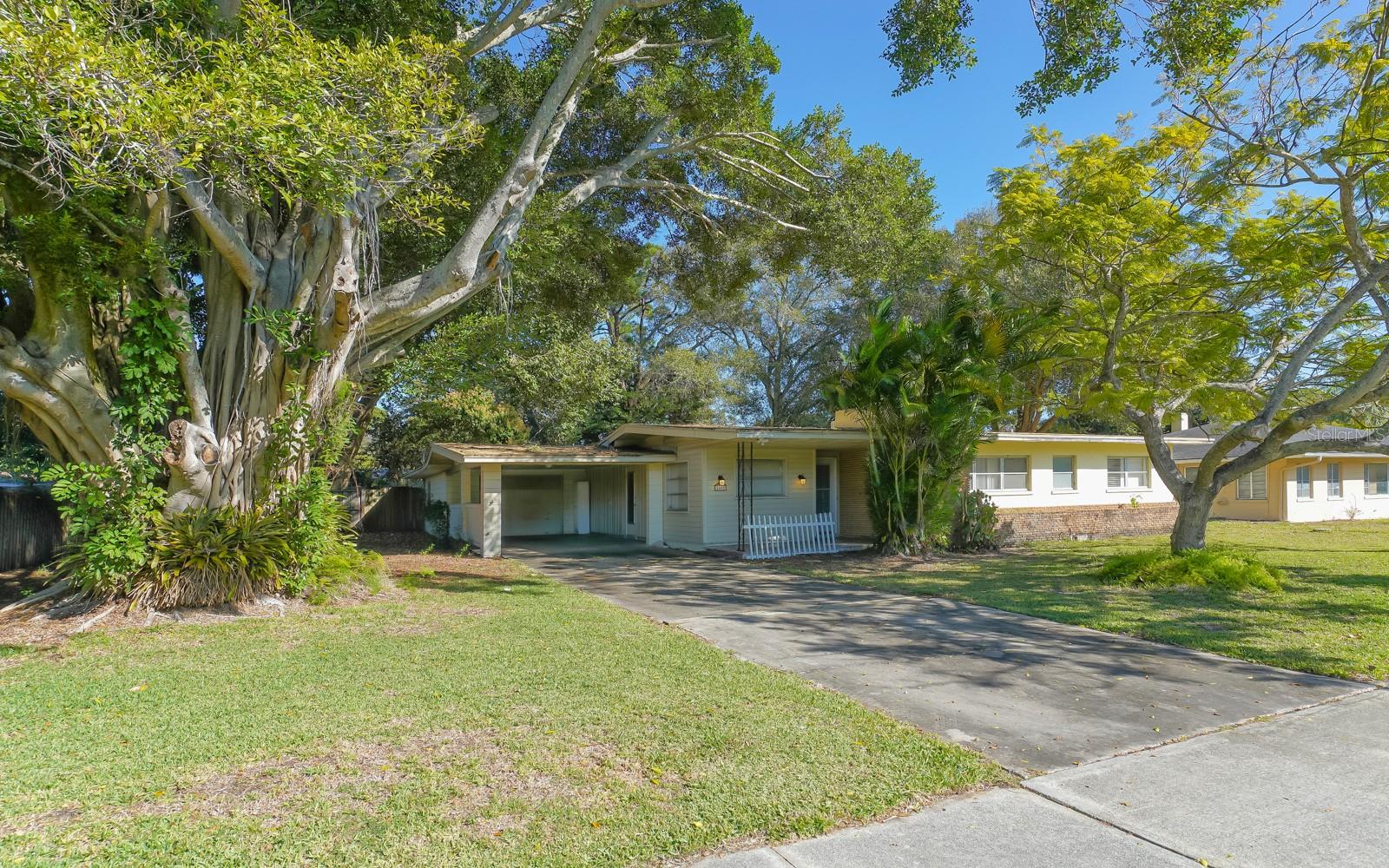 Unlock the potential of this ideally situated property on Ringling Boulevard—just minutes from downtown Sarasota, the Marina, and Gulf beaches. Whether you're planning a full-scale renovation or a complete teardown for new development, this 2-bedroom, 2-bath home offers solid value in a rapidly evolving corridor.  Featuring an open floor plan, carport, workshop area, and a sunlit Florida room, the existing structure provides flexibility for updates.  Yet, the true opportunity lies in the land, positioned along the prominent Ringling Blvd. with redevelopment momentum.