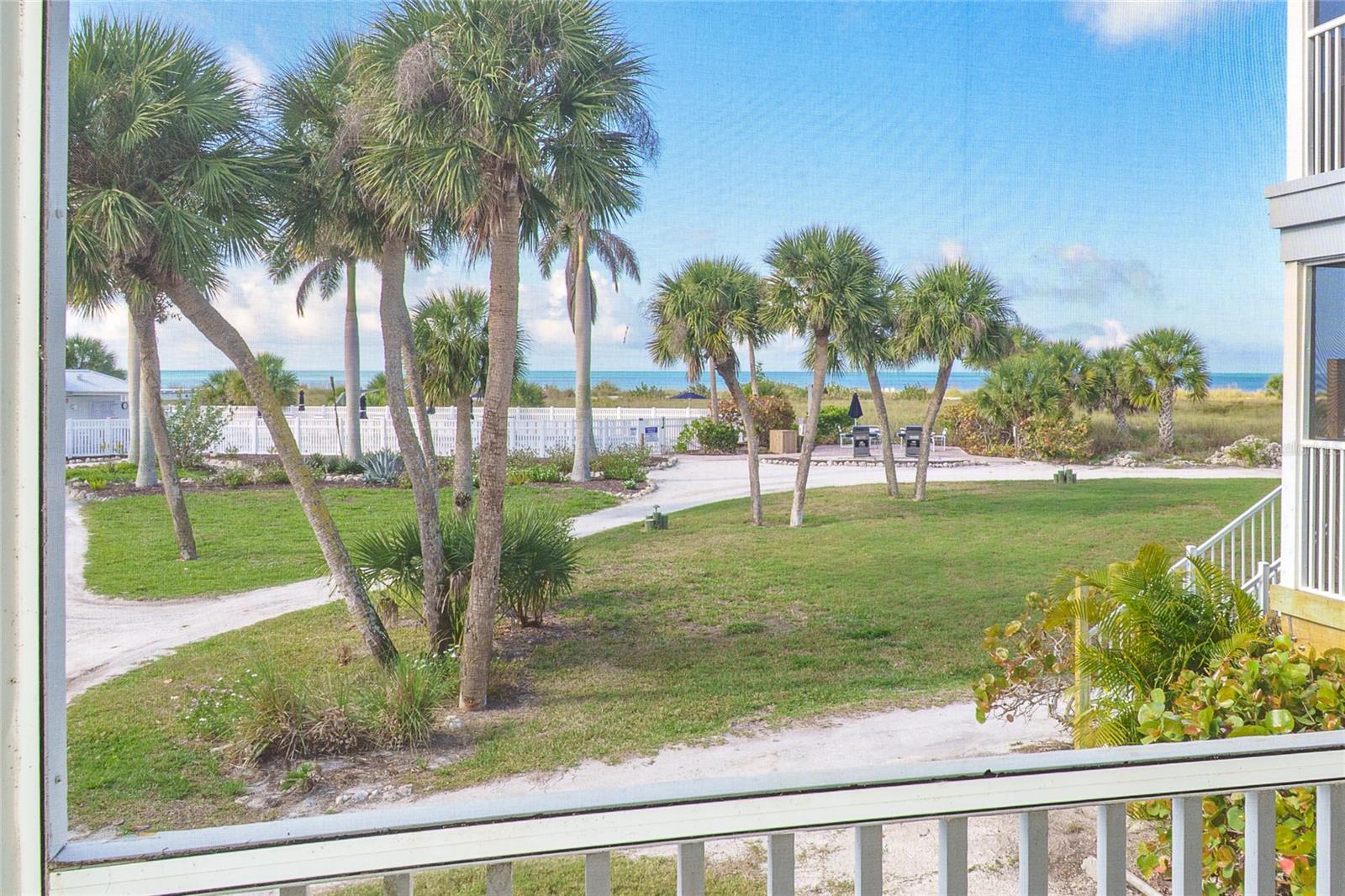 Enjoy serene island living with picturesque views just beyond your doorstep. This inviting coastal retreat features a bright, well-appointed kitchen with crisp white cabinetry, ample counter space, and a full complement of appliances—perfect for effortless everyday living or hosting guests. The open pass-through design connects seamlessly to the living and dining areas, enhancing the light, airy feel throughout. Upgraded wood panel doors are featured throughout, even on the laundry closet. Washer and dryer are new. Tiled throughout for ease of cleaning. Enjoy the screened porch in comfort with the sea breezes blowing. Step outside to take in the beautiful swaying palms and winding paths that lead directly toward the Gulf.  Find the 7 miles of pristine sandy beach and sparkling blue waters, offering the ultimate backdrop for relaxation. Located within an exclusive island community accessible by ferry or private boat, this property provides a peaceful, away-from-it-all setting while still offering resort-style amenities including community pool, on site dining, a vibrant tennis and pickle ball program, fitness room and classes plus a calendar of other activities. Located between Ft. Myers and Sarasota a commute from a few area airports is convenient, TPA, RSW, RGD, SRQ and PIE too. This villa is ready and waiting for you, bring your personal items and start enjoying the essence of Southwest Florida coastal living. This villa has not been in the rental and is in pristine condition and fully furnished for enjoying immediately.