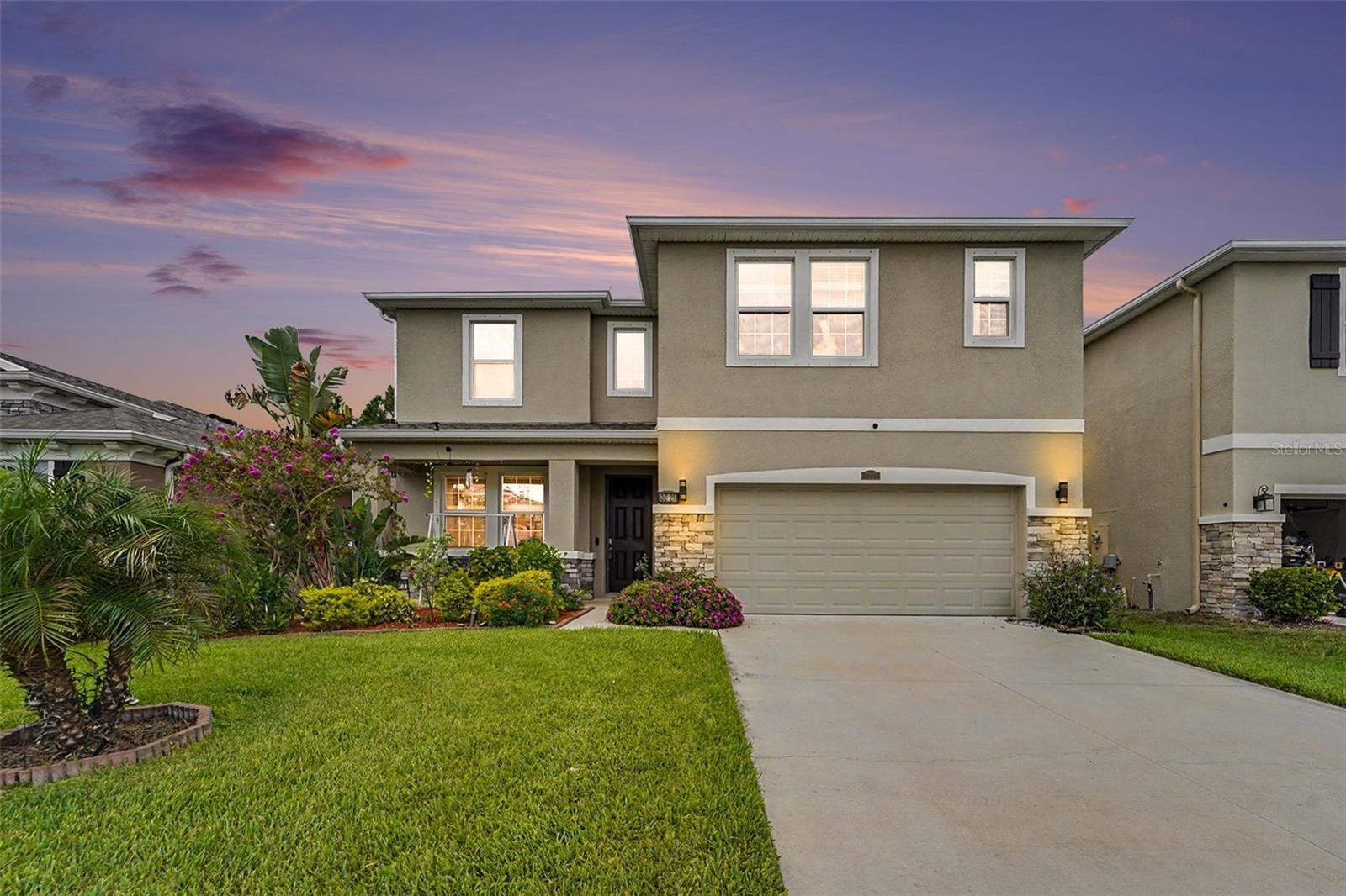 Welcome to this meticulously maintained 5-bedroom, 3 bath home nestled in the beautiful community of The Preserve, Largest floorplan (Talbot), this home boasts modern features, upgraded tile floors, covered lanai on a premium lot with wood views with no rear neighbors—perfect for both relaxing and entertaining. As you step into the foyer you are immediately greeted by the open floor plan and entertaining options of the great room just off the foyer. This space can be used as a sitting room or home office. Through the great room you will see a pass through that has extra cabinets and countertops perfect for a coffee or wine bar along with a spacious walk-in pantry. The open kitchen features modern cabinets, granite counter tops, large island, stainless steel appliances and ample counter space, making meal prepping a breeze. The dinette area located off of the kitchen is the perfect spot for gathering for the holidays and special occasions. The living room offers expansive green views, while the dining area provides sliders that lead to the tiled and covered lanai—ready to become your personal outdoor retreat. The first level also includes a full bath and bedroom for easy access or multigenerational living. As you head upstairs you will find a versatile loft space perfect for a game room or sitting area with a large walk-in closet for extra storage. The well-maintained carpet adds warmth to the upstairs living areas. The Primary bedroom is located just off the loft where you will find access to your private retreat perfect for relaxing after a long day. The ensuite has a walk-in shower, dual sinks, garden tub and walk-in closet. Three additional bedrooms, all generously sized, share the second floor along with a full bathroom featuring dual sinks and a shower/tub combo. The conveniently located laundry room completes the upstairs layout, adding ease to your daily routine. Living in this exclusive community means enjoying resort-style amenities, including: A clubhouse, two luxurious pools: A lap pool and a beach-style walk-out pool with a relaxing, covered dining area, perfect for gatherings by the water. An upgraded fitness room, dog park, playground, half-court basketball court, sports field and direct access to the 42-mile Suncoast Trail. Conveniently situated near shopping, dining, and top-rated schools, you are minutes away from Veterans Expressway with easy access to the Tampa International Airport, Starkey Wilderness Preserve and Park, TPC Golf Course. Don't miss your chance to own this exceptional property. Schedule your showing today and start enjoying the Florida lifestyle you've always dreamed of