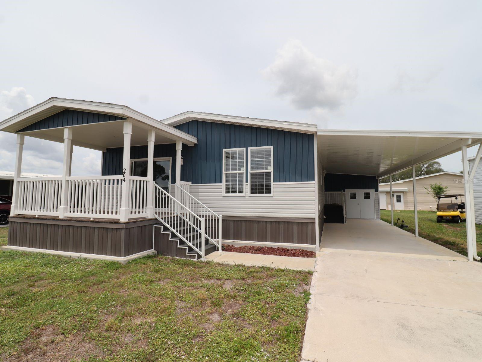 This brand-new 2024 Jacobson manufactured home at 204 El Prado, North Port, FL offers 1,372 sq. ft. of comfortable, maintenance-free living in the active 55+ community of La Casa. The 2-bedroom, 2-bathroom open-concept layout features vaulted ceilings, a massive hidden walk-in pantry, and modern construction built to current hurricane codes. 
Highlights & Property Features include 2 Bedrooms / 2 Bathrooms; 1,372 Sq. Ft. (Lot size: ~0.14 Acres); Built in 2024; 2x6 exterior walls, double-pane insulated windows, stainless steel appliances, and luxury vinyl & carpet flooring; Features an attached 1,372 Sq. Ft. equivalent home-footprint feel alongside a custom 12' x 12' golf cart shed with access doors. Located in = La Casa MHP (55+ active co-op community).  Located perfectly between Sarasota and Fort Myers, residents enjoy a serene neighborhood with mature trees, green spaces, and eight picturesque lakes. Community amenities include:Two heated clubhouses and swimming pools;  A private boat ramp with access to the Gulf of Mexico; Fitness center, tennis courts, and pickleball courts; Social events, recreation facilities, and a private golf-cart-friendly  gated community.