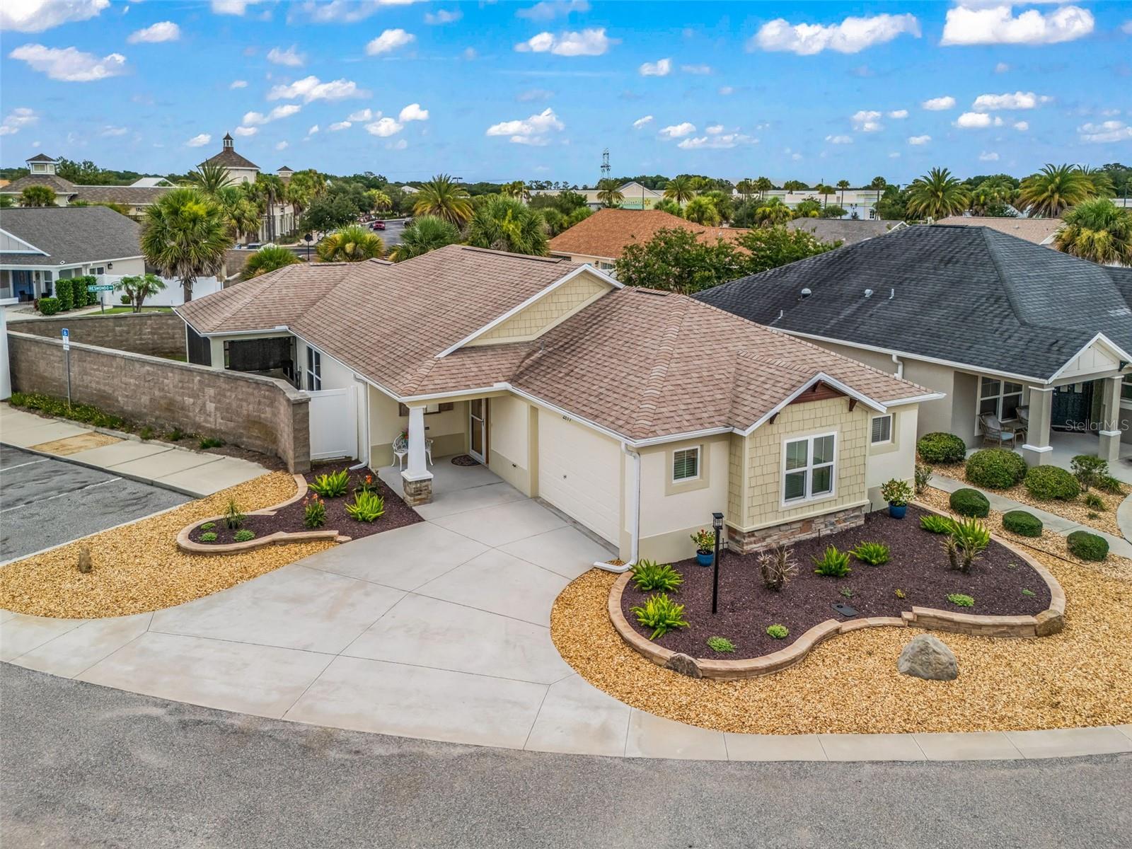 WELCOME to this beautiful COURTYARD VILLA in THE VILLAGES! Right away you'll notice the clean landscaping with decorative stone, colorful flowers, and great curb appeal. Step inside to BEAUTIFUL TILE FLOORING and a thoughtfully designed SPLIT FLOOR PLAN featuring a POCKET DOOR that separates the TWO GUEST BEDROOMS and GUEST BATH, giving family and friends their own private space. The OPEN KITCHEN AND LIVING AREA is bright and spacious, making it perfect for everyday living or entertaining. The kitchen features GRANITE COUNTERTOPS, plenty of CABINET AND COUNTER SPACE, and STAINLESS STEEL APPLIANCES, while the living room offers VAULTED CEILINGS that create an open, airy feel. The OWNER'S SUITE features a TRAY CEILING and an ensuite bathroom with DUAL SINKS, a WALK-IN CLOSET, and a ROMAN WALK-IN SHOWER. One of the highlights of this home is the THREE LARGE SLIDING GLASS DOORS that open to the spacious WRAPAROUND SCREENED LANAI, providing the perfect place to enjoy your morning coffee, relax with a good book, or entertain family and friends while enjoying the beautiful Florida weather. Beyond the home, you'll experience everything that makes THE VILLAGES one of the nation's premier active adult communities, with championship and executive golf courses, recreation centers, swimming pools, pickleball and tennis courts, scenic walking paths, hundreds of clubs and activities, and the convenience of traveling by golf cart to shopping, restaurants, and nightly live entertainment at the town squares. Whether you're looking for a full-time residence or a seasonal getaway, this home offers the LOW-MAINTENANCE LIFESTYLE, endless amenities, and vibrant retirement experience that make THE VILLAGES so desirable.