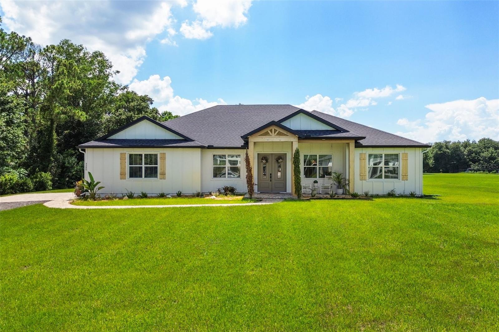 Welcome to 4280 Tucker Ave in Saint Cloud! This is an exceptional 2024 custom built home that seamlessly blends modern luxury with the charm of upscale farmhouse living. Situated on a sprawling 2.4-acre homesite, this beautifully upgraded 4-bedroom, 3-bathroom residence showcases designer finishes and custom touches throughout, creating a truly magazine-worthy living experience.

From the moment you step inside, you’ll appreciate the professionally curated interior featuring custom accent walls, designer wallpaper, elegant window treatments, and high-end finishes that rival the pages of HGTV. The thoughtfully designed floor plan offers spacious living areas, a stunning chef-inspired kitchen, and a private primary suite that serves as a luxurious retreat.

Outside, the expansive 2.4-acre lot provides the perfect balance of privacy and usability, with ample space for a pool, workshop, recreational vehicles, or your own outdoor oasis. Surrounded by newer custom homes on large acreage parcels, this property offers a rare combination of luxury, privacy, and community.

Enjoy the tranquility of country living without sacrificing convenience. Ideally located approximately 20 minutes from Laureate Park and Lake Nona Town Center, 30 minutes from Orlando International Airport (MCO), and 45 minutes from Walt Disney World, this home places Central Florida’s premier destinations within easy reach while allowing you to enjoy the peace, privacy, and space of acreage living.

This is a rare opportunity to own a nearly new, professionally designed home that offers luxury finishes, room to roam, and an unbeatable location in one of Saint Cloud’s most desirable acreage communities.
