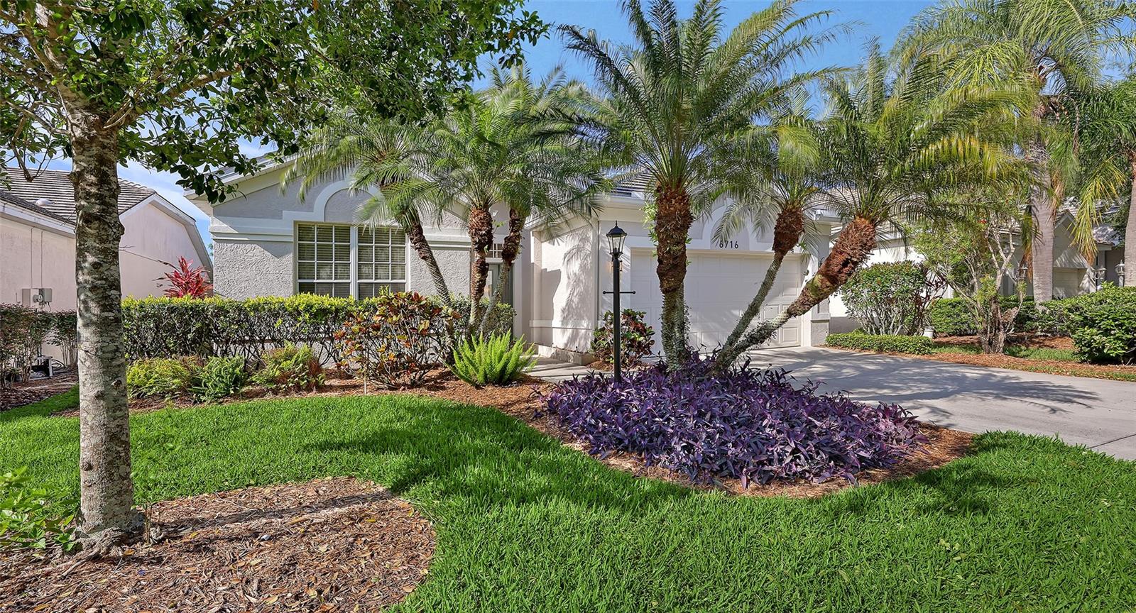 If you are an artist or art collector, or if you enjoy entertaining at home, let this be the home of your dreams. Beautifully updated in 2026 with a new tile roof, new LVP flooring, a new open floor plan, and a SPECTACULAR new kitchen, this home offers features that are rarely found at this price. Yes, the kitchen is exceptional. GE Cafe' Series appliances (gas hookup available if preferred), new cabinets with soft close doors, drawers, and pull out lower shelves, a very large (11 1/2' by 4 1/2') center island, and a 5' by 9' walk-in panty with built in shelves will allow you to prepare fantastic meals while being at the center of your party. There is seating at the island, and the formal dining area is just a few feet away. Choose an expandable table that seats six to twelve, and make it a lively gathering. The great room floor plan was designed to maximize wall space with no obstuctions, to accomodate your art collection as well as an oversized television and complete entertainment center. You will be able to watch TV from anywhere in the room, with your ideal speakers located as you wish for perfect sound. Don't want to party? Just enjoy peace and quiet in this comfortable and flexible space. The split bedroom floor plan places the master suite with adjoining bathroom and large walk-in closet (with custom storage units) at the rear of the home, and two additional bedrooms (one with two closets) that are well isolated from the main living space. The interior space also includes a utility room with LG front load washer and dryer, a closet, and storage cabinets. Outside, the private back yard has a south exposure which is great for winter sun and summer shade, and is ready for you to plan a patio, gardens, or custom screened enclosure. The HOA is responsible for lawn cutting and irrigation. Edgewater Village is a gated maintenance-free community with numerous amenities including walking trails, clubhouse, heated pool and spa, gazebo, a pier and kayak storage overlooking 156 acre Lake Uihlein. The community is located just minutes from Lakewood Ranch Main Street, shopping and dining at University Town Center and Waterside, top-rated tennis facilities and numerous golf courses, Sarasota-Bradenton International Airport, medical facilities, and Sarasota's famous beaches.  This home and neighborhood present an opportunity to enjoy the best of living in Lakewood Ranch at an attractive price. See it today before it's too late!   ***Please note that the Lakewood Ranch CDD is included in the property taxes.
