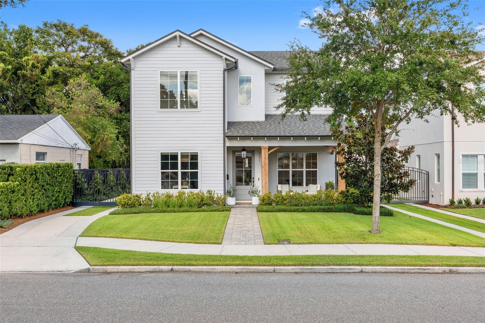 Better than new and beautifully tucked into one of College Park’s most beloved neighborhoods, this custom-built M. Lahr home offers the rare blend of privacy, craftsmanship, and true walkability. Set behind an electronic driveway gate with lush mature landscaping, the home feels tucked away while still placing you just moments from Digress Wine, Shakers Cafe, Lake Adair, Dartmouth Park, and the everyday rhythm that makes College Park so special.

Inside, wide plank engineered wood floors, solid core doors, Baldwin hardware, Visual Comfort lighting, and a full trim package create a refined, designer-level finish throughout. The kitchen is both a statement piece and gathering place, featuring custom soft-close cabinetry, a reclaimed brick backsplash, custom range hood, Samsung professional appliances, gas cooking, dual convection ovens with steam, a dry bar, wine fridge, and open shelving, all flowing seamlessly into the living room for easy entertaining.

The floor plan offers 4 bedrooms and 3 full baths, the downstairs fourth bedroom that can easily function as a guest room or private office. Upstairs, a flexible loft creates additional space for a playroom, homework zone, or lounge, while the vaulted primary suite feels like a calm retreat with a massive walk-in closet. Two additional upstairs bedrooms each offer walk-in closets and share a bath with dual sinks.

Outside, bring vacation home with an 11’ x 26.5’ heated saltwater pool, LED lighting, deck jets, and an expansive covered lanai just beyond the oversized sliding doors, already pre-plumbed for an outdoor kitchen. A wide gate beside the garage offers golf cart parking, perfect for weekend rides to Lake Adair or down Edgewater Drive. Looking for more space, easily add living space above the garage.

Meticulously maintained, thoughtfully upgraded, and set in a walkable tree-lined pocket of Orlando, this is College Park living with big feelings, beautiful details, and a lifestyle that is nearly impossible to replicate.