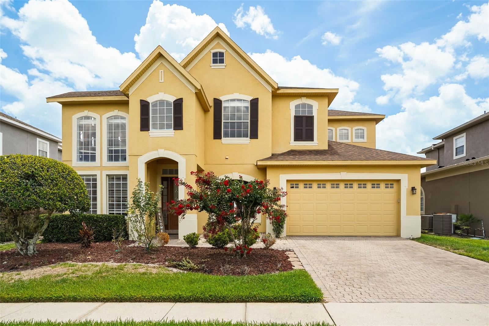Welcome to luxury living in the highly sought-after gated community of The Preserve at Astor Farms. This exceptional 5-bedroom, 2 full and 1 half-bath home offers the ideal blend of elegance, comfort, and resort-style outdoor living. From the moment you enter, you'll be captivated by soaring ceilings, abundant natural light, and dramatic floor-to-ceiling windows overlooking the sparkling pool and tranquil water views. The formal living and dining rooms create an impressive setting for entertaining, while the thoughtfully designed floor plan offers comfortable everyday living. The heart of the home is the beautifully updated chef's kitchen featuring quartz countertops, a striking new backsplash, stainless steel appliances, a GAS slide-in range, new dishwasher, new garbage disposal, and an inviting dinette area. The kitchen flows seamlessly into the spacious family room, creating the perfect gathering space for family and friends. Designed for entertaining, the home features a spectacular custom-built wet bar complete with a sink, refrigerator, icemaker, garbage disposal, custom cabinetry, and a stunning tin ceiling that adds character and sophistication. Whether hosting game day celebrations, holiday gatherings, or intimate cocktail parties, this space is sure to impress. A dedicated home theater with reclining seating and projector offers the ultimate movie-night experience. A versatile first-floor room offers the perfect space for a guest bedroom or home office. Upstairs, the luxurious owner's retreat serves as a private sanctuary with double-door entry, an oversized custom walk-in closet, and a spa-inspired en-suite featuring dual vanities, a garden tub, and an oversized walk-in shower. Step outside to your own private backyard oasis. The screened lanai showcases a sparkling pool and a deluxe outdoor kitchen, all overlooking serene pond views. Additional highlights include a 2021 roof replacement and EV pre-wiring in the oversized garage. Residents of The Preserve at Astor Farms enjoy the privacy and security of a gated community surrounded by nature preserves and scenic ponds, while remaining just minutes from I-4, SR-417, top-rated Seminole County schools, Seminole Towne Center, Colonial TownPark, premier dining, shopping, and entertainment. This is more than a home, it's a lifestyle.