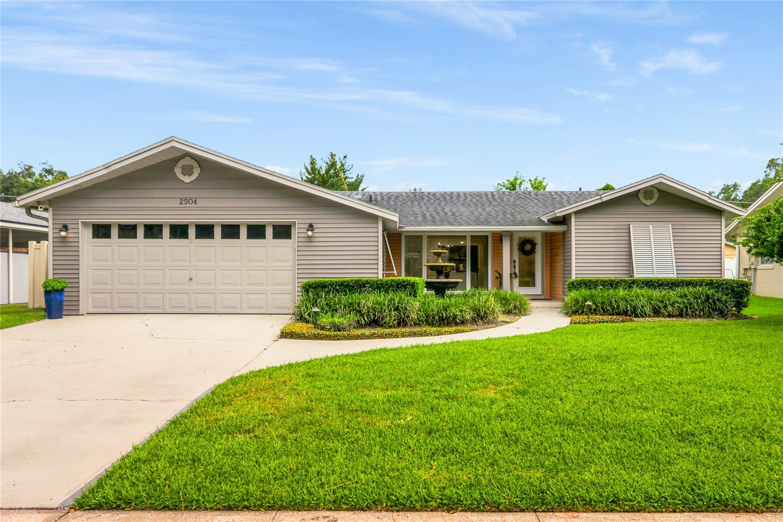 RARE TWO-OWNER MID-CENTURY MODERN HOME IN WINTER PARK PROPER!!  You will fall in love as the canopy of trees along Forfarshire Drive leads you to the door of this desirable Winter Park address.
A fresh exterior re-envisioning brings a modern curb appeal, complete with a beautifully tiled covered front porch, glass entry door, Zen fountain and low architectural awnings provide an immediate sense of style and anticipation of what awaits inside the home.  Upon entry, a large open living area with over-sized picture window and a stylish dining area, adorned with Brazilian hardwood flooring create a relaxed living experience.  
Updated kitchen includes white cabinetry (undermount counter lighting), Sile Stone countertops with undermount sink, stainless fridge & dishwasher and brush nickel hardware finishes.  A large rear bonus room with storage closet space (designer built-ins) and oversized slider door leads to fenced and private backyard, the perfect retreat to relax and unwind.  This wide-shoulder split floorplan offers a left-side primary bedroom with hardwood flooring and a large en suite office with access door to backyard, all wrapped windows with sophisticated Plantation shutters.  The right side guest wing includes two large bedrooms flanking a remodeled full guest bathroom.  KEY UPDATES INCLUDE:  Architectural Shingle Roof (2016), Double Pane Windows (throughout), Knockdown Ceilings, Recessed LED Lighting & Touch Control Switches, PEX Plumbing, Interior Panel Box, Garage Opener.  Walking distance from the finest amenities in the area:  Cady Way Walking Trail, Ward Park, Winter Park Pines Golf Club and the area’s finest Winter Park School District (Brookshire Elementary, Glenridge Middle, Winter Park High).  This home combines prestige and affordability in one irreplaceable address.  See it before the opportunity has passed you by!!