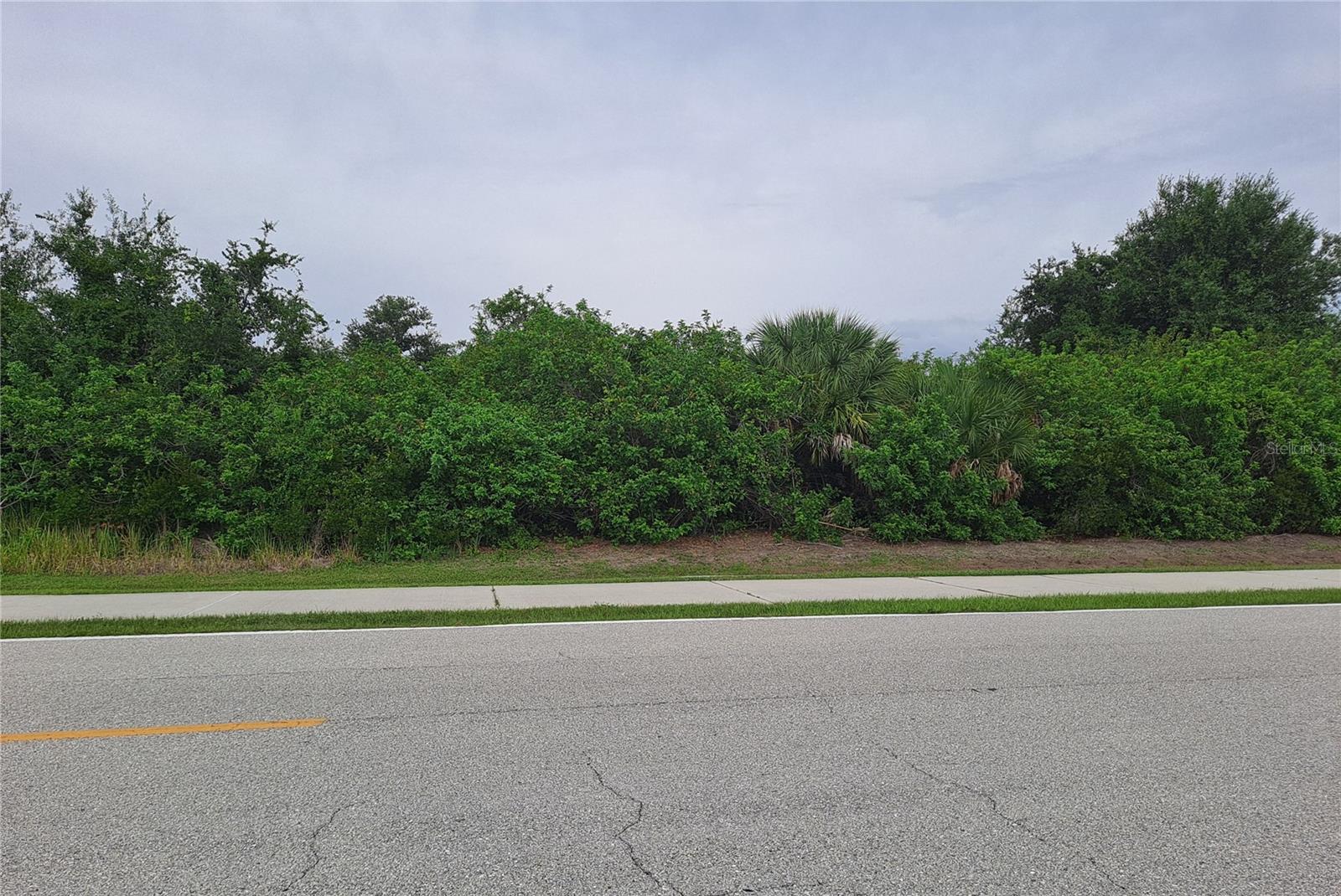 Centrally located lot, in the desirable South Gulf Cove Waterfront Community. This property is conveniently located close to shopping, restaurants, entertainment, and beautiful sandy gulf beaches. The community offers peaceful parks, which include a public boat ramp, picnic area, linear walkway, and playground. The canals and waterways provide an excellent place for kayaking, paddle boarding, and fishing. 10 minutes away from many area golf courses, and 15 minutes to the beauty of the Gulf Coast, its clear water, and sandy beaches. Make this property yours today.