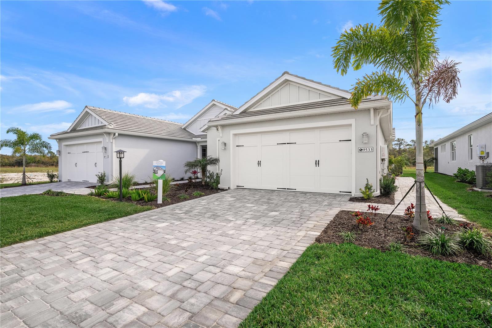 New Incentives Available - LUXURY VILLA! - In the prime location of Shellstone at Waterside this Luxury Villa offers Tile Flooring Through Out, Quartz Countertops, Tray Ceilings, Soft-Close Cabinets, 8' Doors, Impact Glass Windows, Oversized 2- Car Garage and a Screened in Lanai. It's the perfect unit for someone looking to dip their toe into Florida living or maybe someone looking to downsize in square footage and maintenance.     Shellstone at Waterside is a maintenance free and amenity rich community offering Two Amenity Sites. The community features: Pickle Ball Courts, Tennis Courts, Basketball, Playgrounds, Dog Parks, Event Lawn, Screen-in Pavilion, Pool with Spa, Fitness Center, Club House and walking trails throughout the community. There is also a Lifestyle Director, Tennis Coach and Fitness Instructor.     There are furnished models open to the public everyday, but please call the sales office to tour this specific unit.