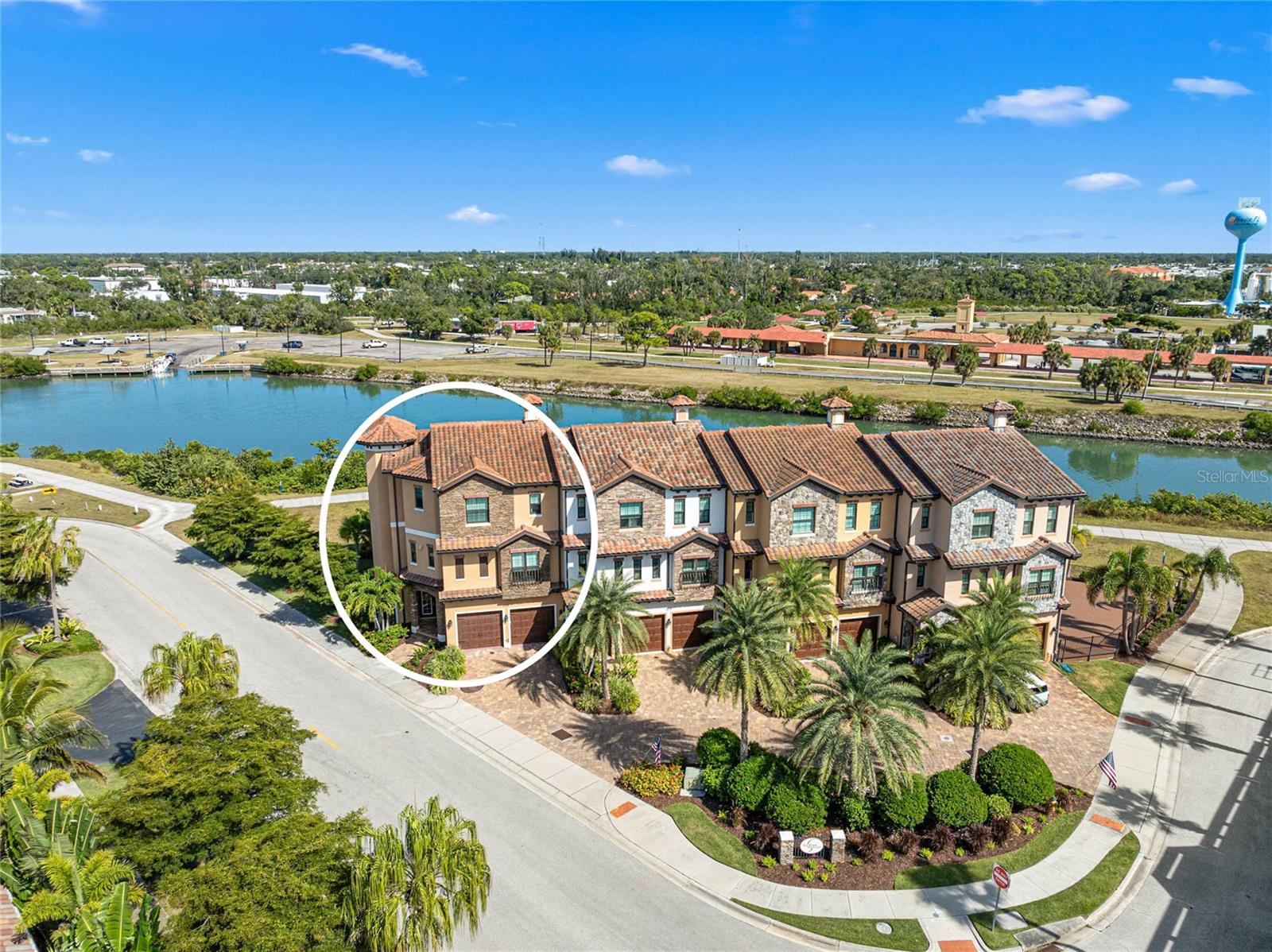 NEW AND IMPROVED PRICE! Experience elevated coastal living (X FLOOD ZONE) in this custom MPS-built luxury residence, completed in 2019 on one of Venice Island’s premier homesites along the scenic Venetian Waterway Trail. PLEASE NOTE: There is NO COMMON WALL shared, unit is separate. Here, timeless craftsmanship meets intentional engineering, surrounded by private landscaping, Intracoastal Waterway views, and effortless walkability to beaches, boutiques, cafés, and Venice’s charming downtown. Inside, every detail reflects artistry and precision. Crown molding in every room, refined lighting selections, and custom ceiling treatments highlight the home’s flawless finish quality. Imported Italian porcelain tile and rich textures complement the expansive linear quartz fireplace, creating a stunning focal point that blends warmth and modern design. Premium tile flooring, installed with precision, enhances the home’s serene coastal palette and natural flow. A private elevator, equipped with a dedicated landline phone, provides effortless access to all three levels—a thoughtful convenience paired with the architectural beauty of solid wood staircases that ground the home with warmth and craftsmanship. Engineered for comfort and quiet efficiency, this residence features whole-house expanding spray foam insulation, individually zoned Mitsubishi climate control with separate air handlers on each floor, a fire suppression system, hurricane-impact windows and doors, and a whole-home instant hot water system—delivering peace of mind and modern performance. The outdoor living spaces are equally intentional. The custom Walpole Outdoors pergola, crafted from solid-cell PVC AZEK with an aluminum core, is both beautifully designed and completely maintenance-free—a rare balance of art and function. Cypress ceilings enrich both the front porch and lanais, adding depth and timeless character to each outdoor space. The back lanai, framed by a decorative wrought-iron fence and privacy landscaping, offers a tranquil retreat for morning coffee or golden-hour sunsets. From here, enjoy layered views of the Intracoastal Waterway, the Venice Train Museum, and the peaceful Venetian Waterway Trail—an authentic glimpse into the rhythm of Venice Island living. Even the garage is elevated with a Gorilla Garage floor coating, offering a sleek, designer-grade finish 20x stronger than epoxy, combining durability with high-end design. From the cypress-paneled lanais to the artisan-crafted interior finishes, every element of this home is intentional, curated, and timeless—delivering the refined coastal lifestyle buyers dream of. Beyond the home itself, Venice Island living offers a lifestyle unlike any other. Walk the Waterway Trail at sunrise. Bike to the beach in minutes. Stroll to boutique shops, al fresco dining, or enjoy live music, the Venice Theatre, and seasonal festivals beneath palm-lined streets. From the weekly farmers market to emerald-green golf courses and waterfront parks, every day here is a celebration of connection, comfort, and coastal sophistication. This is more than a residence—it’s an invitation to live beautifully, where craftsmanship meets calm and the timeless charm of Venice Island becomes part of your everyday story. ¤ Please see 3D Tour and Video ¤