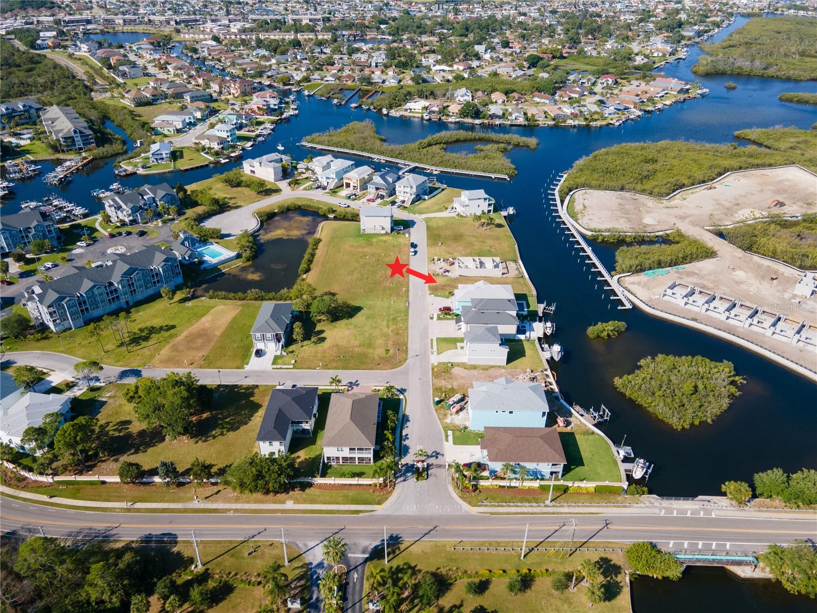 Imagine building in this quiet enclave of MILLION DOLLAR HOMES. Easy GULF ACCESS just outside your back door - 52 FEET OF WATERFRONT and a SEAWALL, no bridges, and PLENTY OF ROOM FOR YOUR DOCK & LIFT.  Harbor Colony at Gulf Landings is a beautiful, GATED community with just 40 homesites and there are ONLY A FEW WATERFRONT LOTS LEFT, so don't miss out! NEW PORT RICHEY IS THE PLACE TO BE ON THE GULF COAST!  The vibrant downtown offers many amazing restaurants, shops, live concerts, riverfront park and much more. Don't miss out on the opportunity to build your home where you can feel like you are on vacation year-round! Enjoy a short boat ride to the gulf to fish, scallop, swim, visit nearby Anclote Key, or just watch an amazing sunset.  Enjoy the resident only PRIVATE BEACH CLUB that has 1/4 mile of soft white sand, restrooms, covered picnic areas and grills for just $200 a year. Quarterly HOA dues are only $260 and there is no CCD.  Buy now and build later! Come live the best of the Florida lifestyle!