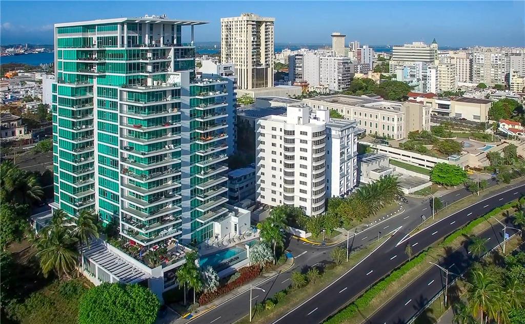 Masterful design and modern luxury are uniquely embodied in this sub-penthouse located in Cosmopolitan, the most secure residential building in San Juan.  The 3-bedroom, 4.5-bath residence has a total of 4,307 sqft., with floor to ceiling glass and north/east exposures providing extraordinary direct views to the Condado Lagoon, the Atlantic Ocean and the sunrise over the San Juan skyline and mountains.  Step outside onto one of the oversized covered terraces and enjoy the outdoor kitchen, fresh air and the scenic views.  Renovated in 2019 the top of the line kitchen features custom Poliform cabinets, marble countertops and professional grade appliances including Sub-Zero, Wolf and Miele. The divine master suite also enjoys floor to ceiling glass, an oversized his and hers closet and opulent master bathroom with a standalone soaking tub and separate glass shower. Featuring Control4 home intelligent system the residence is fully automated. This smart system controls not only the lighting and the audio but the temperature as well.   The property includes three parking spaces on the first floor of the garage and an oversized storage room unique to this residence only.   

The Cosmopolitan building is located the Arts District of Miramar, where you can enjoy a short walk to the conservatory of music, local restaurants, movie theaters, parks and outdoor activities.  The building has 24/7 security and concierge for the service of the residents. As part of the amenities for residents are a recently renovated infinity pool and outdoor common space, executive conference room, lounge bar, pantry and kitchen area for activities, billiard table, children play area and gym facilities.