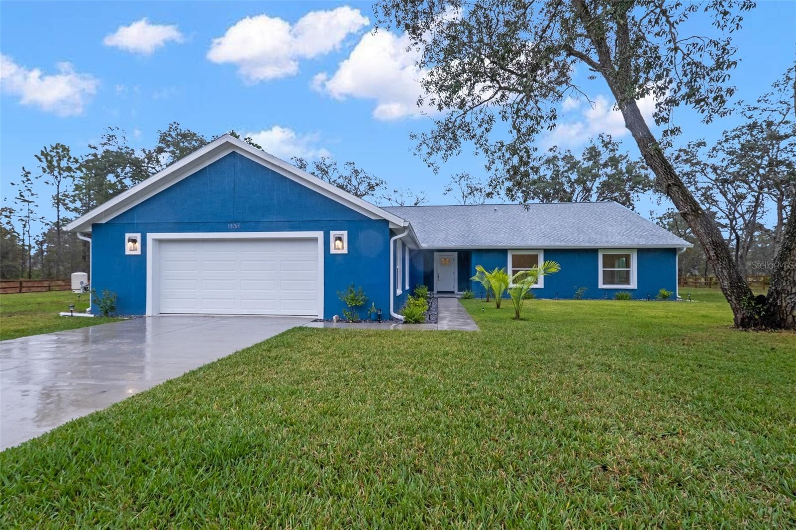 MOVE-IN READY!! LOOKING FOR A NEW CONSTRUCTION HOME and don't want to wait for it to be built? Looking for privacy in your backyard? How about baking up to 160 acres of preserved woodlands? No rear neighbors to look at and no one to look at you!!  NO HOA!! Bring your ATV's, boat, RV, camper, toys...bring it all! State owned lot to the left of the new house, as well! Can't beat that for privacy!! BRAND NEW HOME IN 2022...everything is NEW!! NEW ROOF! NEW AC! NEW IMPACT WINDOWS!! NEW SEPTIC AND DRAIN FIELD!!  Nothing to to worry about for many, many years to come!! Just relax on your back patio and connect with nature in the peaceful privacy the home affords you!! This is a LARGE home with 2,425 sq feet of living space; 3,356 sq ft total! The STUNNING kitchen is an EVIOUS MASTERPIECE with large stunning modern island design with Fantasy Brown granite breakfast bar! NEW gorgeous real wood cabinets, NEW stainless steel appliances, NEW designer light fixtures, faucets, and farm house sink! The kitchen is open to the main living spaces of the home! The high ceilings (13.5 feet high), open floor plan, large glass sliders and large windows make this home feel light, bright, spacious and cheery! Lots of natural light makes it happy and comfortable feeling! Luxury vinyl plank flooring throughout the home!! The home was designed for the lot with the bedrooms facing the private wooded 160 acres in the back of the house!  Located in the fast-growing, highly desired Royal Highlands with the newest schools in the county...Winding Waters and Weeki Wachee High School!! Oversized garage (26x26)!   NO CDD!!  NO FLOOD ZONE!! Appraised recently above asking price!!
