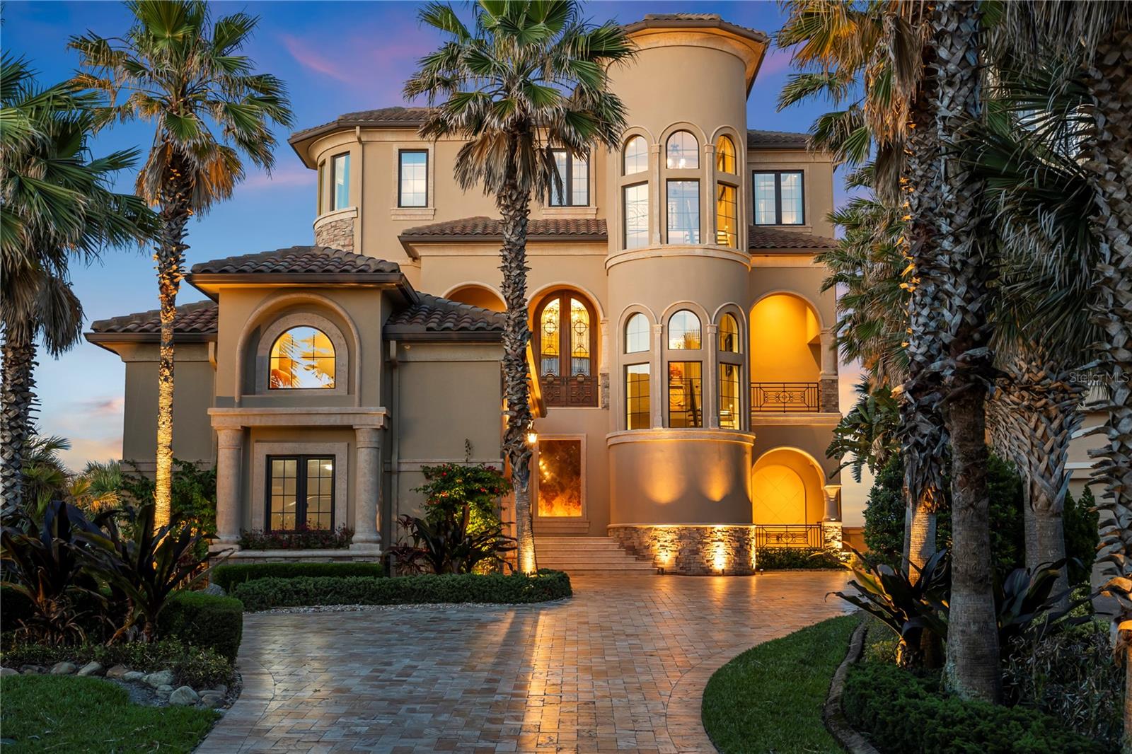 There are exceptional properties. There are exceptional homes. When the two unite, it is a once in a lifetime opportunity.

Proudly presenting a rare opportunity for the discerning few to acquire an oceanfront legacy home. An ideal community, setting, and home to be the gathering place for family and friends for many years. Nestled majestically on Ocean Crest Drive, upon one of the finest homesites on Florida’s Atlantic Coast, this exquisite home was designed to maximize the sweeping views of the ocean, beach, and the Jack Nicklaus signature ocean course and preserve.  Over several years of planning and construction, every detail was meticulously thought through and executed by leading craftspeople and trades from across the country. The home offers an unparalleled experience of luxury living, yet it has a timeless appeal which is best described as ‘beach elegant’. As the sun rises and sets over the last four holes, known affectionately as 'The Bear Claw' by Nicklaus himself, the landscape transforms into a breathtaking panorama.

With an eye on detail, a 3-foot stem wall raises the home above the already 20-feet from sea level. Capturing 270-degree views, the home also ensures maximum privacy. A travertine driveway welcomes you to the home with every detail meticulously planned and beginning with the 3-car oversized garage with beautiful stained custom cedar doors and equipped with electric vehicle hookup. 

The 2nd level main entrance leads to a custom designed front door. The home has a walnut wood-lined elevator. The owner took attention to create custom ceiling designs and great window designs. For comfort, the six en-suite bedrooms have separate AC controls and ceiling fans, as do all other rooms. The expansive 2nd floor living, dining, and social space features walnut floors and custom, 10-foot frameless turtle-reflective commercial-grade glass windows (on all three floors), allowing the beauty of the surroundings to permeate every corner. There is a wonderful private office/den with built-ins and golf and ocean views. One focal point for the family is the custom step-down bar and the artfully designed waterfall wall. A hidden-in-floor television (master suite too) keeps the view the main thing. The gourmet kitchen with top-of-the-line Wolf 6-burner gas stove, two dishwashers, and a large Sub-Zero refrigerator, is a chef's dream, and has a large pantry hidden from view. The 2nd floor patio has a step-down design to maximize unobstructed viewing of the ocean when inside. All Patios have custom cypress wood ceilings. The outdoor kitchen with Wolf grill and sink area provide more get together moments. The home has bug spray mist system on all patios for comfort year-round. 

The first-floor has wonderful ocean views and features an infinity-edge pool, hot tub, a large ocean front sun patio for tanning, and an outside walled ‘beach’ shower. Inside is a sitting area and custom bar, three ensuite bedrooms, an 800+ bottle glass-walled wine room, a fitness room, and spacious laundry room. The top floor has two guest ensuite bedrooms and the lavish primary suite with pedestal bed, crystal Swarovski light sconces, and large patio. A lavish master bath completes the suite with a curved custom glass shower, soaking tub, and 3 large windows for more ocean viewing. With impeccable attention to detail and many more features and amenities, 368 Ocean Crest Drive epitomizes Beach-Elegant living at its absolute finest.