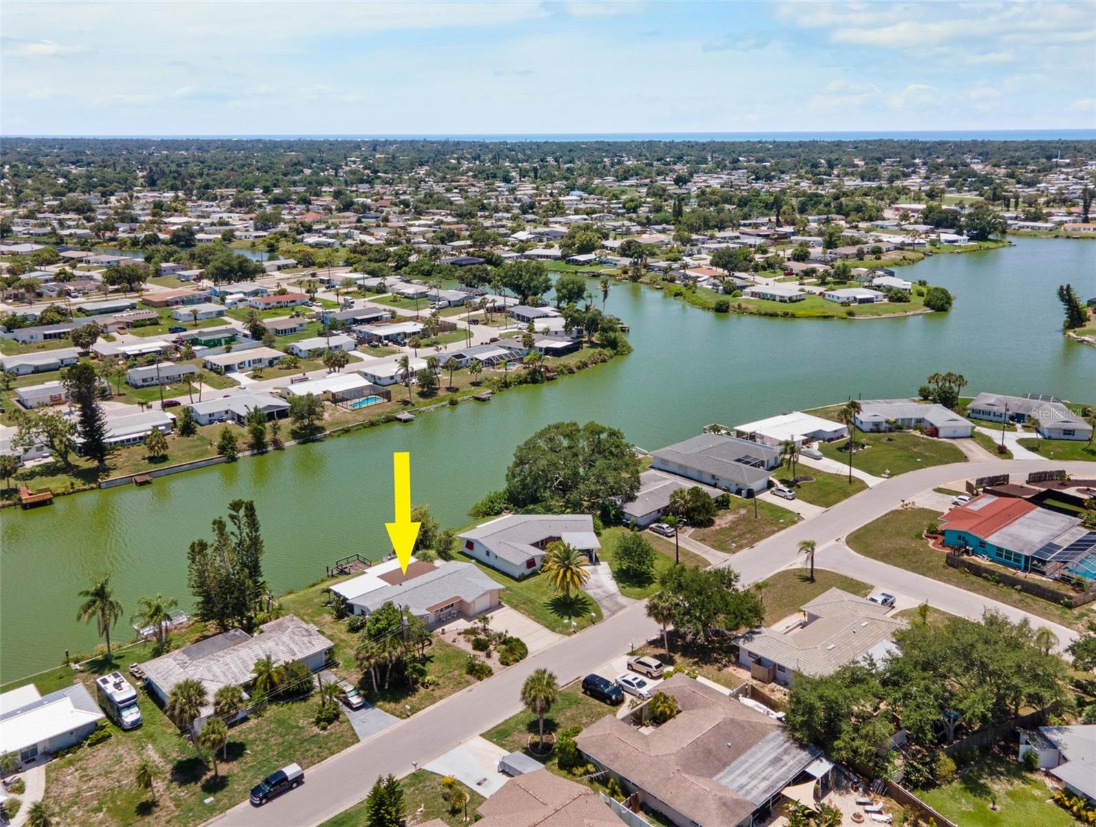 Experience the beauty of waterfront living in this exceptional Venice Gardens home, where thoughtful updates, picturesque views, and timeless Florida charm come together. Boasting IMPACT WINDOWS, a NEW ROOF, and TERRAZZO FLOORING THROUGHOUT, this residence offers lasting quality and effortless style. Designed to make the most of its setting, the home features TWO FULLY COVERED SCREENED LANAIS, ADDITIONAL COVERED PATIO SPACE, a private dock, and a spacious AIR-CONDITIONED FLORIDA ROOM overlooking the lake, creating an inviting space to gather, unwind, or simply enjoy the peaceful scenery. Extensive storage solutions throughout the home add everyday convenience.***
Inside, a bright and welcoming layout showcases a living room enhanced by BUILT-IN SHELVING, a striking ACCENT WALL, and a versatile WALK-IN CLOSET. The beautifully updated kitchen is both functional and elegant, featuring QUARTZ COUNTERTOPS, NEWER STAINLESS-STEEL APPLIANCES, and a SERVING WINDOW. The serving window opens directly into the Florida room, allowing for easy entertainment and seamless connection between the living spaces. A dedicated WINE BAR COMPLETE WITH A WINE REFRIGERATOR adds a sophisticated touch and creates the perfect space for serving guests and displaying your favorite vintages. Both bedrooms offer generous BUILT-IN CLOSETS, while two full bathrooms accommodate family and guests. An interior UTILITY ROOM provides additional storage, houses the washer and dryer, and offers direct access to one of the screened lanais.~~~
Located in the desirable Venice Gardens community, this property offers more than just a home, it offers a lifestyle. Residents enjoy nearby parks, walking paths, and the option to join the Venice Gardens Civic Association for access to a community pool, playground, and clubhouse. Just a short drive from Downtown Venice, Venice Island, Gulf beaches, shopping, dining, golf, and everyday conveniences, this location combines waterfront enjoyment with easy access to everything that makes Southwest Florida such a sought-after destination. Call today to schedule your private showing!