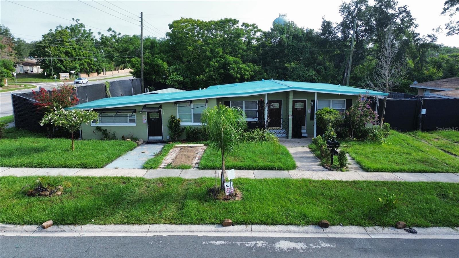 Excellent investment opportunity! This triplex features three separate 1-bedroom, 1-bathroom units with individual electric meters, offering flexibility for investors and owner-occupants alike. Situated on a spacious 0.29-acre lot with no HOA, the property features a metal roof installed in 2019 and permitted commercial-grade fencing that provides added privacy and security. One unit is owner occupied, one is tenant occupied, and one unit is currently vacant, creating an excellent opportunity to move in immediately or lease the vacant unit at market rent. Whether you're looking to expand your rental portfolio or offset your mortgage by living in one unit while generating rental income from the others, this property offers excellent income potential. Conveniently located with easy access to major roadways, shopping, dining, schools, and everyday amenities. Triplex opportunities with separate electric meters, valuable upgrades, and flexible occupancy are hard to find. Don't miss your chance to own this versatile Orlando investment property.