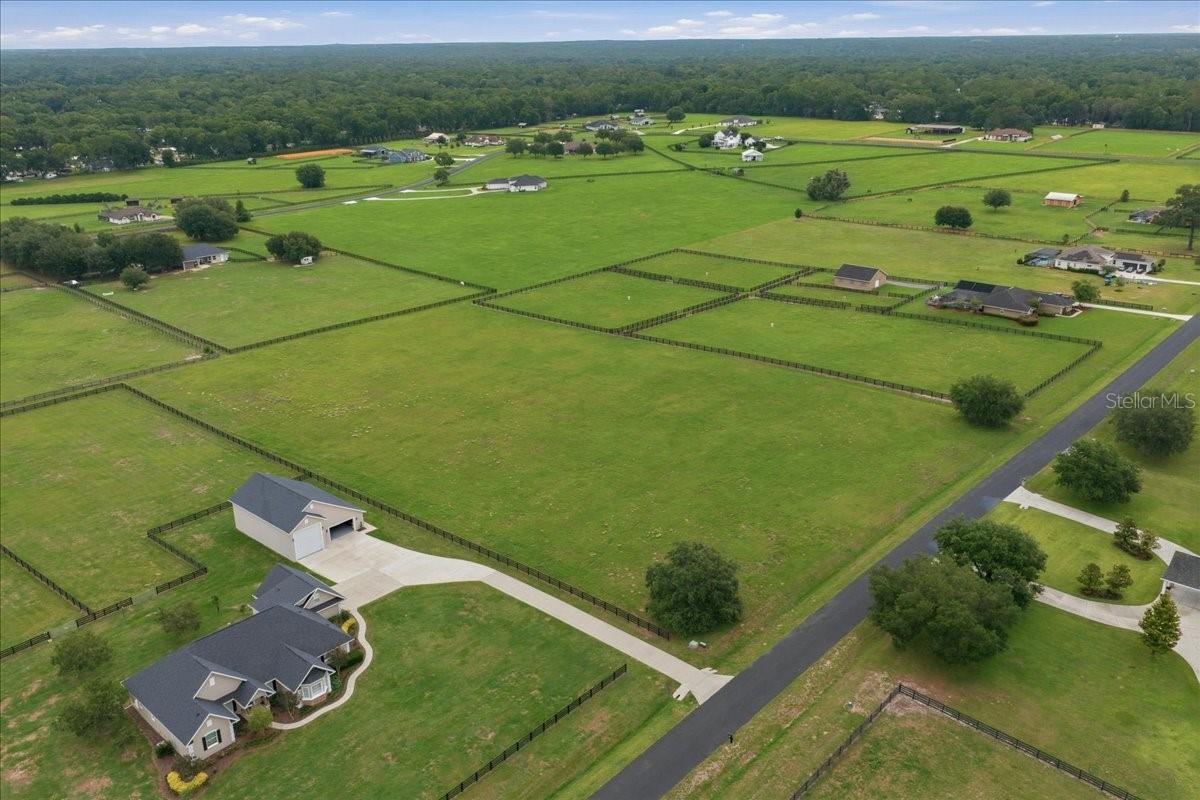 Welcome to the highly sought-after, gated community of Hunterdon Hamlet. Nestled right in the heart of Ocala’s prestigious horse country, just off the scenic NW Highway 225A, this beautiful 5-acre vacant parcel offers the ultimate canvas to design your dream mini-farm or luxury estate. Surrounded by rolling hills and prestigious estate homes, this parcel provides the perfect blend of privacy and convenience, located just minutes away from the world-class World Equestrian Center, premier dining, shopping, and so much more.