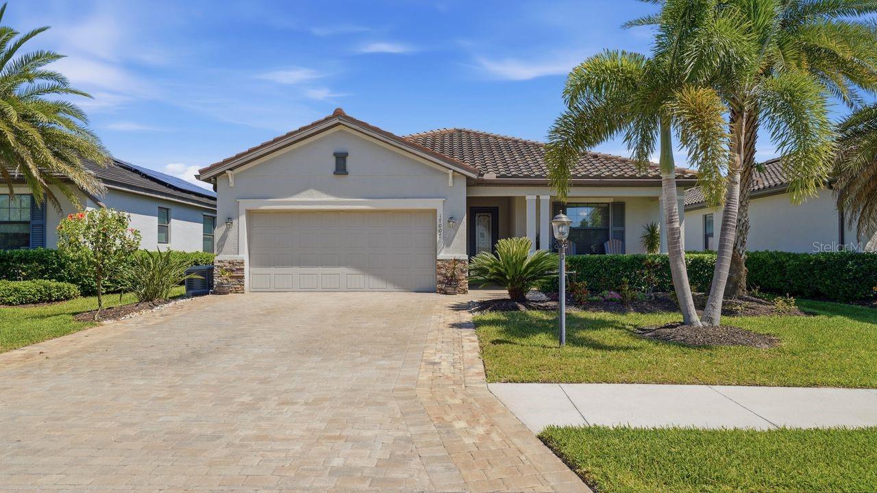 Welcome to the highly sought-after Polo Run community in Lakewood Ranch, where this stunning Venice model blends modern upgrades with everyday comfort and peace of mind.  This beautifully maintained 3 bedroom, 3 full bath home is thoughtfully enhanced inside and out.  From the moment you arrive, you will note the widened driveway and meticulous attention with beautiful landscaping.  A whole-home generator provides added security and reliability, ensuring comfort no matter what the conditions.  
Step inside to a welcoming entry equipped with an Alert 360 security system and beautiful custom cabinets.  The spacious living room is designed for both relaxation and entertaining, featuring updated lighting, stylish ceiling fans, custom fit sliding door blinds, and a wonderful surround sound system that delivers true home theater quality.   
The kitchen is a chef's dream, offering generous counter space, a large pantry, elegant lighting, including cabinet uplighting and designer pendant lights over the island - creating both functionality and ambiance.  The primary and guest bedrooms feature luxury vinyl flooring, ceiling fans, and soft, tastefully selected paint tones that create a calm and inviting atmosphere throughout the home.  The dining area is elevated with custom lighting, perfect for hosting family and friends. 
Enjoy watching your favorite movies or sporting events with the awesome surround sound system! The garage offers a mini air conditioning and heating unit, built-in work table, closets, wall storage system, and added insulation in both the door and attic - making it as functional as it is energy efficient.  This home backs to a beautiful and peaceful preserve where birds and nature abound.     
This exceptional home offers not only beautiful living spaces but also thoughtful upgrades that enhance comfort, efficiency and lifestyle, set within one of Lakewood Ranch's most desirable communities with resort style amenities.  
Experience the perfect blend of style, convenience, and peace of mind in this move-in ready gem.  Minutes from shopping, dining and I-75, Polo Run has so much to enjoy within a private, gated community designed for both relaxation and recreation.  Don't miss this wonderful opportunity.  
SOLAR PANELS ARE LEASED AND TRANSFERS AT CLOSING.