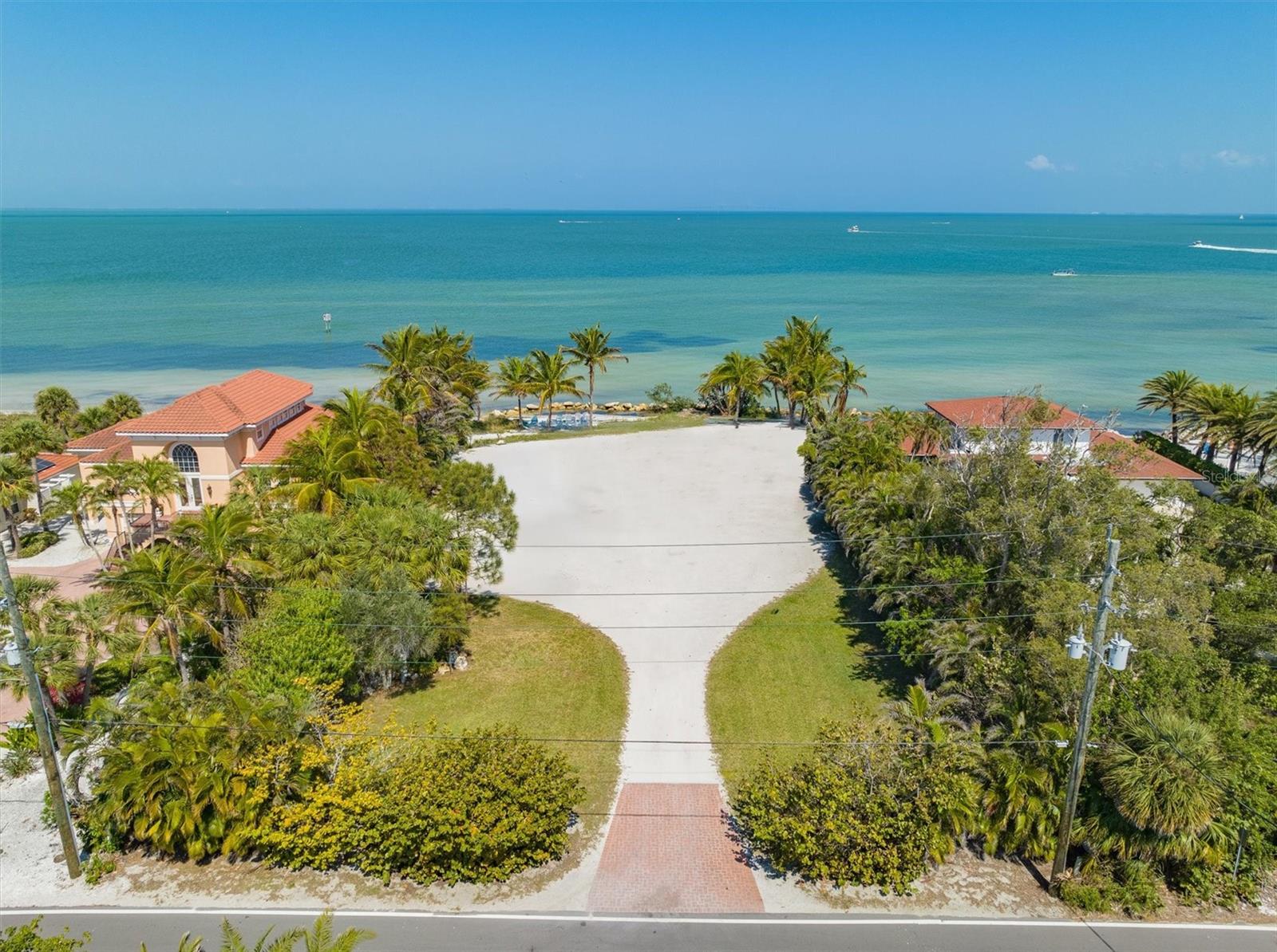 BAYFRONT LOT!  Private bay beach with 120 feet of bay frontage to build your dream home!!!!   The lot is 255 feet deep and includes 4 docks and 2 lifts, the possibilities are endless!  There are very few lots with this much bay frontage and depth that are secluded.  Literally step out onto your own sandy bay beach and enjoy the views of the water and the Sunshine Skyway that also lights up your nightly view.  Imagine a rooftop deck to enjoy the panoramic views of the island. Restaurants within walking distance including the very popular Waterfront Restaurant. Start living your island lifestyle in paradise today!  Buyer to verify lot split possibilities.