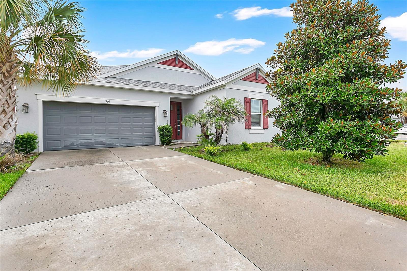 Located in the gated Lakeside community, this beautifully designed 4 bedroom, 3 bathroom home offers the perfect blend of comfort, style, and convenience. Residents enjoy access to community amenities including a swimming pool and fishing pier, all while being just minutes from major roadways, shopping, dining, and Central Florida's renowned attractions. Inside, you'll find a spacious open-concept floor plan filled with natural light. The main living area flows seamlessly into the dining space and covered lanai, creating an inviting setting for both everyday living and entertaining. The well appointed kitchen features a large center island with seating, abundant cabinetry, a generous walk-in pantry, and an adjacent flex space ideal for a home office, playroom, or additional living area. The private primary suite is thoughtfully situated away from the secondary bedrooms and includes a spacious walk-in closet and an en-suite bathroom with dual vanities, a soaking tub, a separate walk-in shower, and a private water closet. Three additional bedrooms provide flexibility for family, guests, or workspace needs. One bedroom is conveniently located near a full bathroom, making it an ideal guest suite or private office, while the remaining bedrooms are served by another full bath. A centrally located laundry room adds everyday convenience. With its functional layout, generous living spaces, and desirable community amenities, this home offers an exceptional opportunity to enjoy the best of Central Florida living.