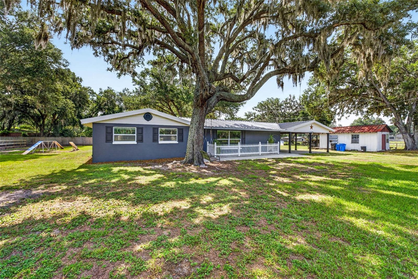 Tucked away on a private road with very little traffic, this renovated 3 bedroom, 2 bath ranch home brings together space, privacy, and a true country lifestyle in a convenient Plant City location with a short commute to Tampa. Sitting on just over 7 acres, the property is zoned for horses, cattle, and more, with two large pastures with water already in place. Inside, you’ll find a comfortable layout with a large bonus room featuring a wood-burning fireplace, perfect for relaxing, entertaining, or creating a second living space. The home is high and dry with no flood insurance required, and includes a well with a water filtration system. Outside is where this property truly shines. Enjoy a large working shed, oversized carport, producing garden, chicken coop, bat houses, and a birdhouse that regularly welcomes bluebirds. The chickens can even stay with the property, so breakfast may come with the keys. With room for animals, gardening, hobbies, equipment, and peaceful country living, this Plant City property is ready for its next owner.