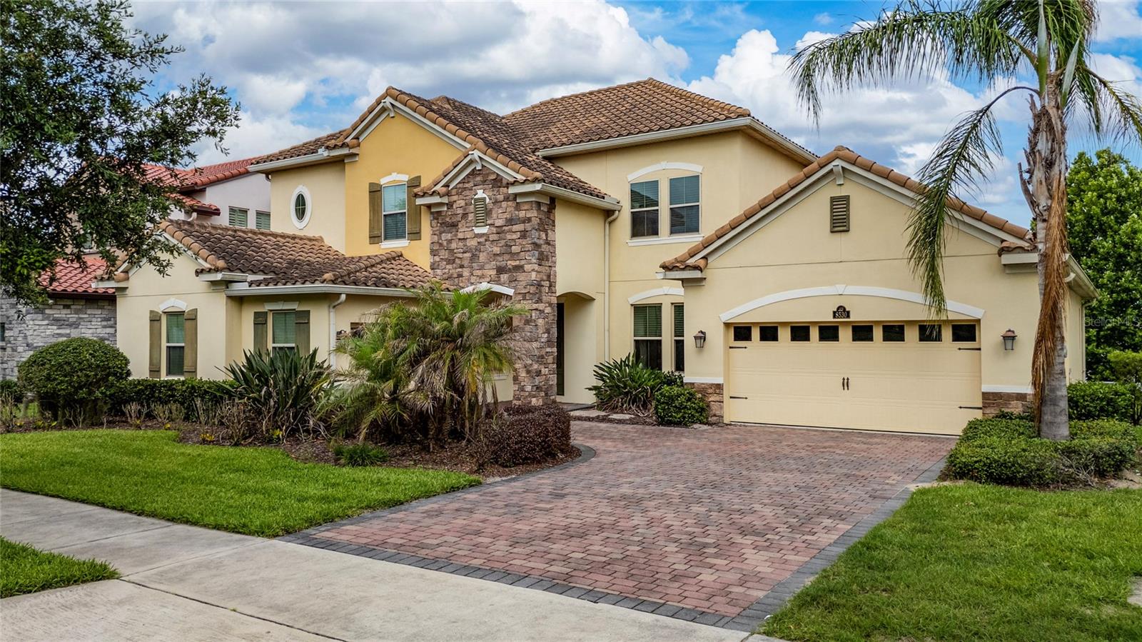 Rare opportunity to own an exceptional lakefront residence with a private dock and breathtaking panoramic water views in one of Winter Garden's premier resort-style communities. Offering approximately 4,663 square feet of living space, this impressive home features 4 bedrooms, 4 bathrooms, and a 3-car garage on a spectacular direct lakefront homesite.
Designed to maximize the stunning waterfront setting, the home showcases soaring ceilings, elegant architectural details, expansive living spaces, and abundant natural light throughout. The gourmet kitchen features an oversized island, double ovens, walk-in pantry, and seamless flow into the main living areas, all positioned to capture beautiful lake views.
The luxurious primary suite serves as a private retreat with direct access to a covered second-floor balcony overlooking the water. Additional indoor and outdoor living spaces, including a covered lanai, provide the perfect setting for entertaining or simply enjoying Florida's year-round lifestyle.
Residents enjoy access to resort-style amenities including pools, clubhouse, fitness center, walking trails, and playgrounds. Conveniently located near shopping, dining, entertainment, and major roadways, this remarkable waterfront property offers luxury, privacy, and an unparalleled lakefront lifestyle.