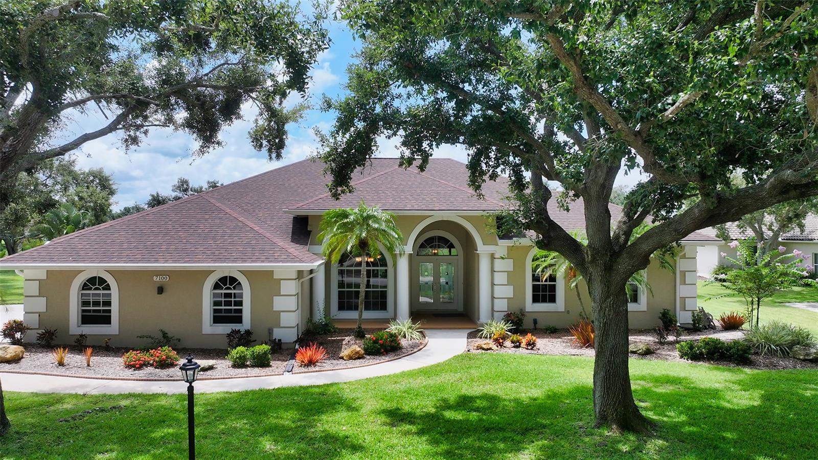 Here is the one you have been waiting for, fully updated & in move-in condition. This home sits on 6/10 of an acre with expansive lake & golf course views. Featuring over 3,000 sq. ft. under air of architectural elegance. This beautifully renovated home offers 4 full bedrooms, office & 3 full baths. Office could serve as 5th bedroom if needed. The entire home has wood look tile floors with no carpet in the home. Newly updated kitchen with all soft close white cabinets, granite counters, stainless appliances & under counter Kinetico water purifier for cooking. All bathrooms have been renovated to current decor with granite counters & custom tile in showers. Solar heated saltwater  pool has a new picture frame screen to enhance the views & new pool pump. Roof was replaced 5 yrs. ago. 2 new  A/C units 4 & 2 yrs old. All windows & doors are impact glass accept for front of the house &  kitchen bay window. Re-built wood fireplace in family room. Whole house Kinetico water softener. 2 1/2 car side load garage offers additional space for storage. Golf course membership is optional. Community has tennis courts & also a bar restaurant. Very low association fee of $1250 per year. Every home has a private well for irrigation, all lots are 1/2 acre & up & all garages are side entry or courtyard giving the community a clean open feeling. Mature Oak tree canopy throughout the community with deer always seen roaming the neighborhood. If you want gorgeous views & room between homes this is the one for you. Location is amazing with easy acess ti I-75, restaurants & shopping all nearby.