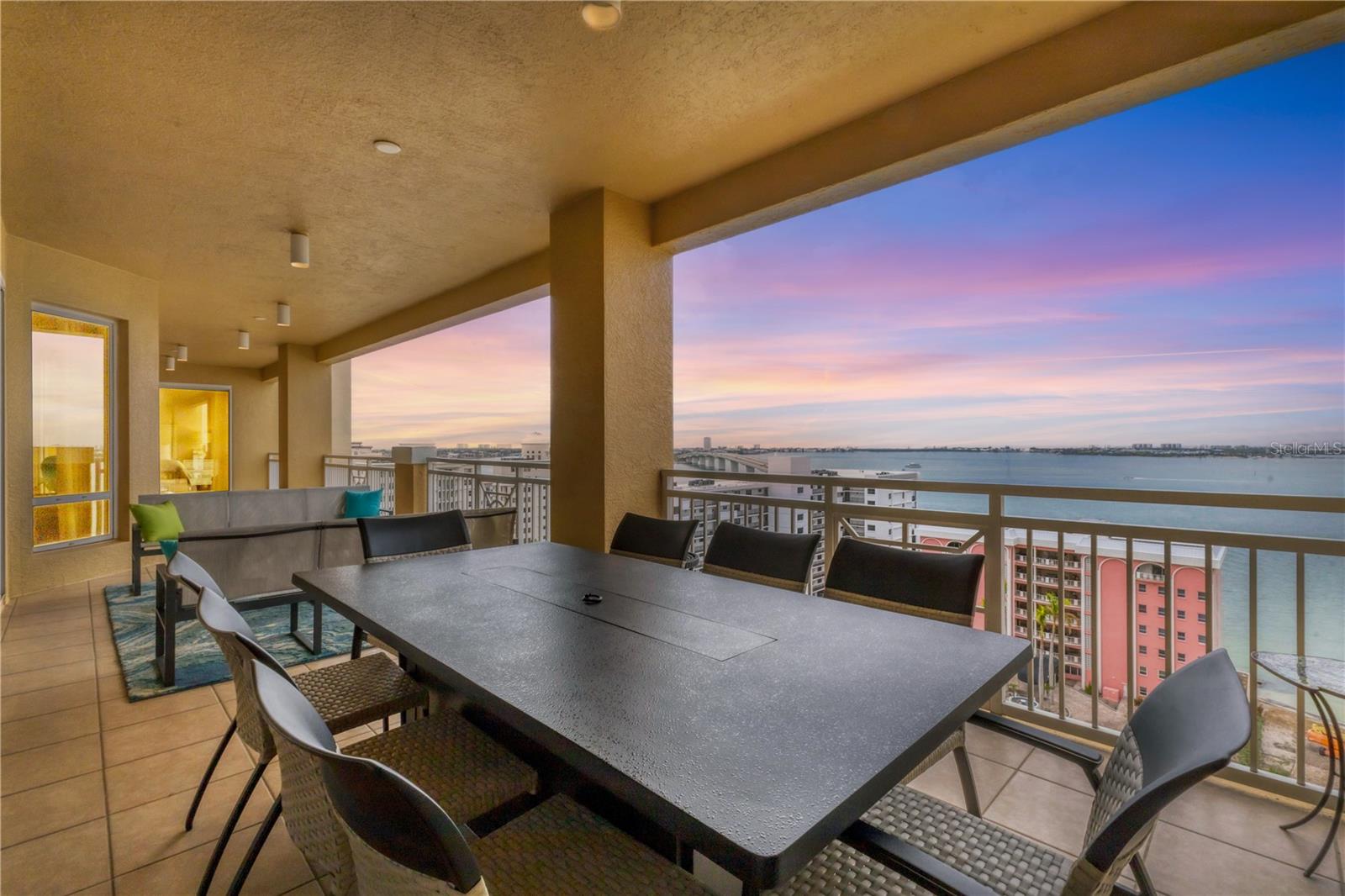 The Tower Residences. Perched on the 12th floor, the home captures wide-open bay and Gulf views. A 54-foot private balcony runs the length of the living space, creating seamless indoor-outdoor living and a true waterfront feel. The location puts you minutes from downtown Sarasota’s dining, shopping, and beaches. Inside, clean lines and thoughtful upgrades define the space - rich wood floors, designer lighting, and motorized blinds with hidden-track drapery. The kitchen is built for both everyday use and entertaining, featuring Carrera marble countertops, dual Dacor wall ovens, a Thermador induction cooktop, paneled Sub-Zero refrigeration with freezer drawers, and a 59-bottle wine cooler. Tower residents enjoy full-service living with 24-hour concierge, in-residence dining, and Ritz-Carlton privileges worldwide. Amenities include a fitness center with sauna and steam, massage rooms, multiple social spaces, a private theater, and a heated pool and spa with outdoor kitchen. The lobby has been recently redesigned with a modern, refined look, and the pool area is being enhanced - adding even more value to an already premier waterfront lifestyle.