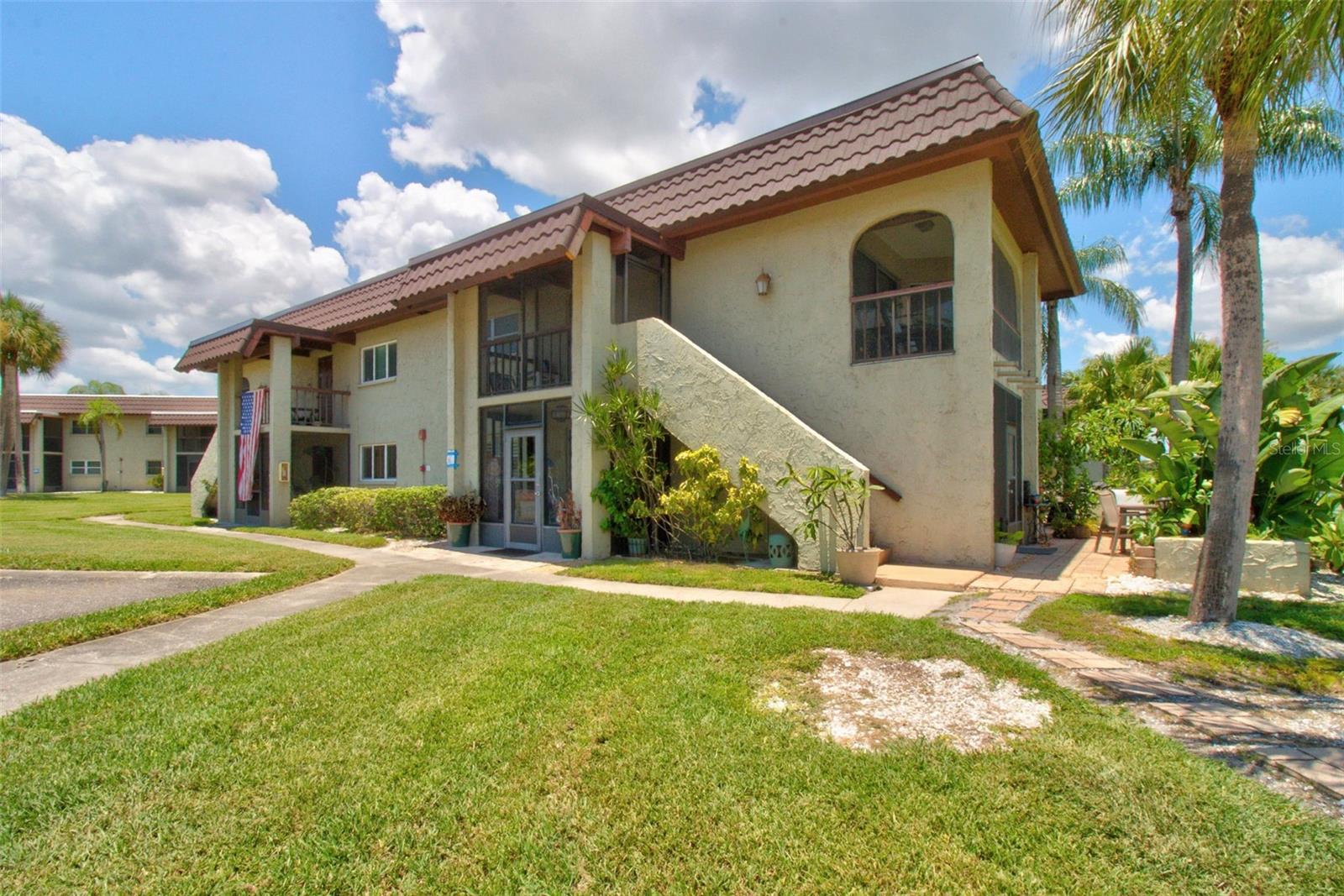 Rare first-floor end unit with three private outdoor living spaces in the heart of Safety Harbor!   This beautifully maintained first-floor end unit offers exceptional privacy and abundant natural light, featuring two enclosed screened patios plus a private outdoor patio overlooking peaceful water views—perfect for morning coffee or simply relaxing while enjoying Florida's beautiful weather year-round.
Inside, the open-concept floor plan creates a bright, inviting space ideal for everyday living.  The updated kitchen showcases gorgeous stainless steel appliances, beautiful flooring throughout, and flows seamlessly into the spacious living and dining areas.
The oversized primary suite easily accommodates a king-size bed and features plantation shutters along with an incredible custom closet expansion, creating an oversized walk-in closet complete with a seating area, vanity space, or dressing room. Whether you prefer one luxurious closet or two separate walk-in closets, the possibilities are endless.
The updated full bathroom offers timeless style, while the dedicated laundry room provides generous shelving for additional storage. The washer and dryer convey with the home. Additional updates include a 6-year-old HVAC system and a newer electrical panel, providing added peace of mind.  Sandal Cove is a pet-friendly community offering a heated pool, kayak and paddle board launch, scenic walking paths, and beautifully maintained tropical grounds. Even better, the HOA includes cable, high-speed internet, water, sewer, and trash, making everyday living simple and convenient.  The location is truly exceptional. Enjoy a short stroll to the Tampa Bay waterfront, Safety Harbor Marina, the Bayshore walking and biking trail, waterfront parks, fishing, and the charming shops, restaurants, breweries, and year-round festivals that have made downtown Safety Harbor one of Tampa Bay's most beloved destinations. You're also just minutes from Costco, Target, countless dining options, Tampa International Airport, and downtown Tampa.
Whether you're searching for a full-time residence, seasonal retreat or low-maintenance Florida lifestyle, this exceptional home offers the perfect blend of comfort, convenience, and easy living in one of Safety Harbor's most desirable communities.
