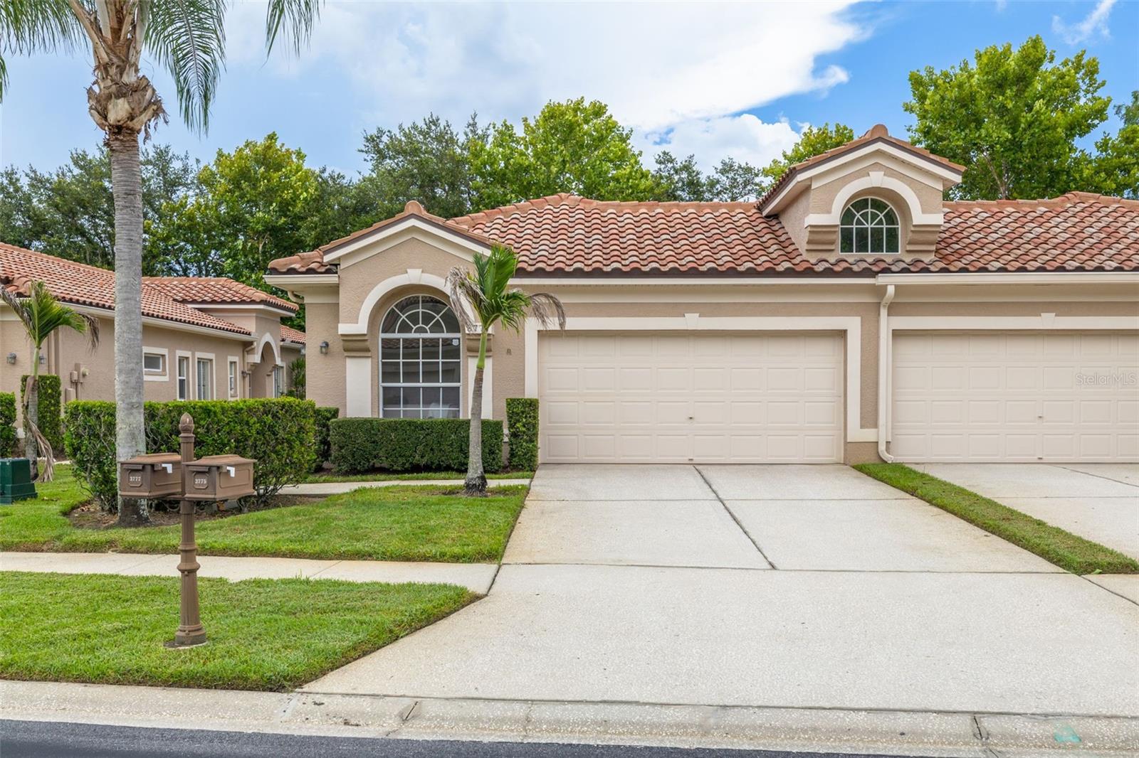 Welcome to this beautifully maintained end-unit villa located in the gated community of Salem Village within the highly sought-after Ridgemoor community. Perfectly positioned with beautiful pond views from the front door, living room, primary suite, and screened lanai, this home offers a peaceful setting with the only adjoining wall being the garage. The desirable split floor plan features 3 bedrooms, 2 bathrooms, 2 car garage with high ceilings, neutral paint colors, an inside laundry room, and an open, inviting layout. The kitchen offers wood cabinetry, granite countertops, island, and updated appliances, making it ideal for both everyday living and entertaining. Recent updates include a 2023 HVAC system and 2023 water heater, while the tile roof was replaced in 2014. Relax on the screened lanai overlooking the pond and enjoy Florida's natural beauty right from your backyard. The HOA provides outstanding value by covering the tile roof, exterior maintenance, lawn care, cable, trash service, and access to the heated community pool. Residents of Salem Village also enjoy all the amenities Ridgemoor has to offer, including tennis courts, basketball courts, playgrounds, scenic walking areas, and abundant wildlife. Conveniently located along the desirable East Lake corridor in Palm Harbor, you're just minutes from John Chesnut Sr. Park, Lake Tarpon, shopping, dining, banking, and everyday conveniences. World-famous Clearwater Beach and Honeymoon Island are also just a short drive away, making this the perfect place to enjoy the Florida lifestyle.