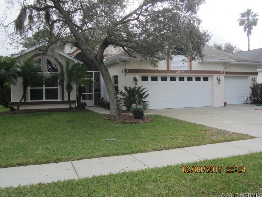 Exceptional find .  This 3 Bedroom 2 Bath home is ideally situated on the 18th Fairway of Turnbull Bay Golf Course. Etched glass front door invites you into this open floor plan.  Great Room with built-in book cases, cathedral ceiling with 10' sliders and large trapezoid designed fixed glass panel.  The Gourmet Kitchen has to be seen to capture the beauty of all the features including cherry wood cabinets to ceiling.  Don't worry about reaching those upper cabinets, a library style sliding ladder is incorporated into the design. Plenty of counter space to satisfy any chef.  All S/S appliances, under counter wine cooler, pantry with rotating panels, large pull out spice shelves.  Dining Nook has built-in benches and a granite table.  Master Bedroom large enough for private sitting area or office work station.  Third Bedroom being used as Den. Laundry Room includes front load washer and dryer and sink. Screened Lanai with panoramic views of the golf course has Summer Kitchen tile flooring, Bose speakers, and, except for wicker sets, all furniture in this area is included..   Oversized 3 car garage (35'x22') has  extra wide pull down stairs leading to a Florida Basement designed  into the plan. Chest style freezer and work benches remain.  Service door at rear of garage.  16 SEER A/C installed in 2014. Landscaped islands situated throughout the property. Most furnishings in home are negotiable. Owners are also including a large custom designed wall clock in the Kitchen and a large wreath especially made for the front of the house over the garagesSeller relocating, very motivated. ;Water: City
