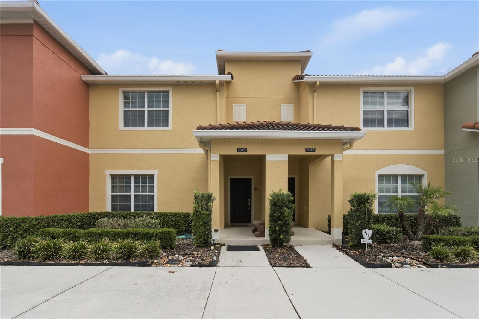 Experience the perfect blend of comfort, convenience, and resort-style living in this beautifully maintained vacation home located in the highly sought-after Paradise Palms Resort, just minutes from Walt Disney World, world-class dining, shopping, and Orlando’s top attractions. This spacious property features a private screened-in pool overlooking a tranquil water view, creating the perfect setting to relax after a day of fun. The covered lanai offers plenty of space for outdoor dining and entertaining, while the open-concept layout provides comfortable accommodations for families and guests alike.   One of the standout features of this home is its access to Paradise Palms’ spectacular 9,500-square-foot clubhouse, offering amenities typically found in luxury resorts. Residents and guests enjoy a stunning lagoon-style resort pool with waterfalls, spa, water features, and a tropical poolside bar and grill. The clubhouse also includes a state-of-the-art fitness center, a private movie theater, game room with arcade games, billiards, and air hockey, internet café, business center, convenience market, and a beautifully appointed lobby with concierge-style reception. Outdoor recreation includes a playground, volleyball court, basketball court, walking paths, and beautifully landscaped gathering spaces designed for all ages. Whether you're searching for a primary residence, vacation retreat, or income-producing investment property, this home offers the ultimate Central Florida lifestyle with a private pool, peaceful water views, and access to one of the area's most impressive resort amenity packages. Located in a gated community with 24-hour security and just a short drive from Disney, Universal Studios, golf courses, shopping centers, and Orlando International Airport, this property is perfectly positioned to enjoy everything Central Florida.