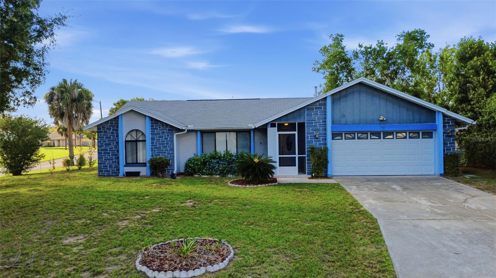 Welcome home to this three bedroom, two bathroom home situated on a corner lot in the desirable Indian Ridge community, where short-term rentals are permitted. The floor plan offers both formal and casual living spaces, with a living room that flows into the dining area and a spacious family room overlooking the fenced backyard. The kitchen has been updated with quartz countertops and a tile backsplash, while both bathrooms have also been updated. The primary suite is privately located off the living room and features dual vanities and an ensuite bathroom. Two additional bedrooms are positioned off the family room and share a full bath. New carpet and a two-car garage add to the home's appeal. Outside, enjoy a privacy-fenced backyard with room to relax, entertain, or play. Indian Ridge residents enjoy access to a community pool, playground, tennis courts and more with a low HOA fee of $70 annually! Conveniently located just minutes from Disney, major attractions, shopping, dining, and Orlando International Airport, this property is well suited as a primary residence, vacation home, or income-producing investment.