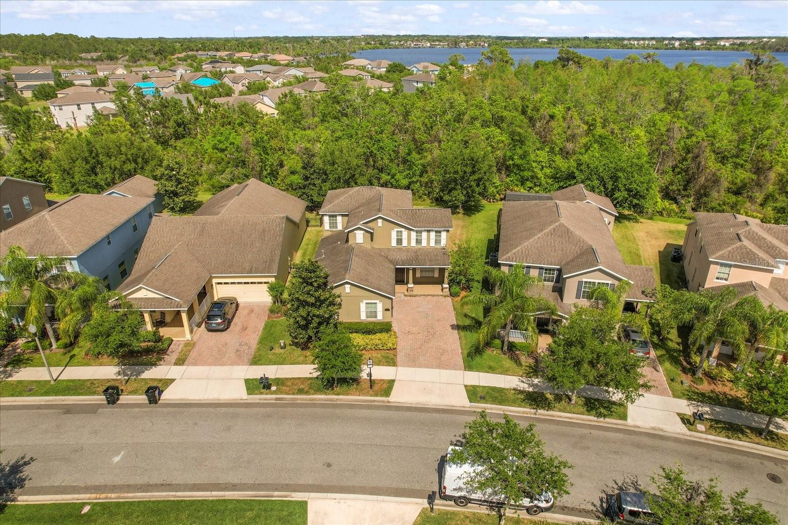 Welcome to this spacious 4-bedroom, 3-bathroom move-in ready home with brand new high quality Vinyl floor and fresh new Interior Paint! Located in the resort style Signature Lakes/Independence community, this property will be your ideal home with its great open floor plan and a large covered lanai at the back overlooking conservation, perfect for relaxation. Home owners have easy access to community amenities, including community pools, fitness centers, tennis and basketball courts, scenic walking/biking trails, two boat ramps for access to Lake Speer & Lake Hancock, and much much more! Independence community is known for its HOA hosted seasonal festivals, July 4th Fireworks Spectacular, & Summer Splash Bashes with lots of family friendly activities. It's close to schools, Orange County Park and Sports Plex, the Hamlin Retail Center, Fowlers Grove, and have easy access to the 429 highway, The HOA includes cable and internet, adding to the home's value and convenience. Buyers verify with HOA about fees and by laws