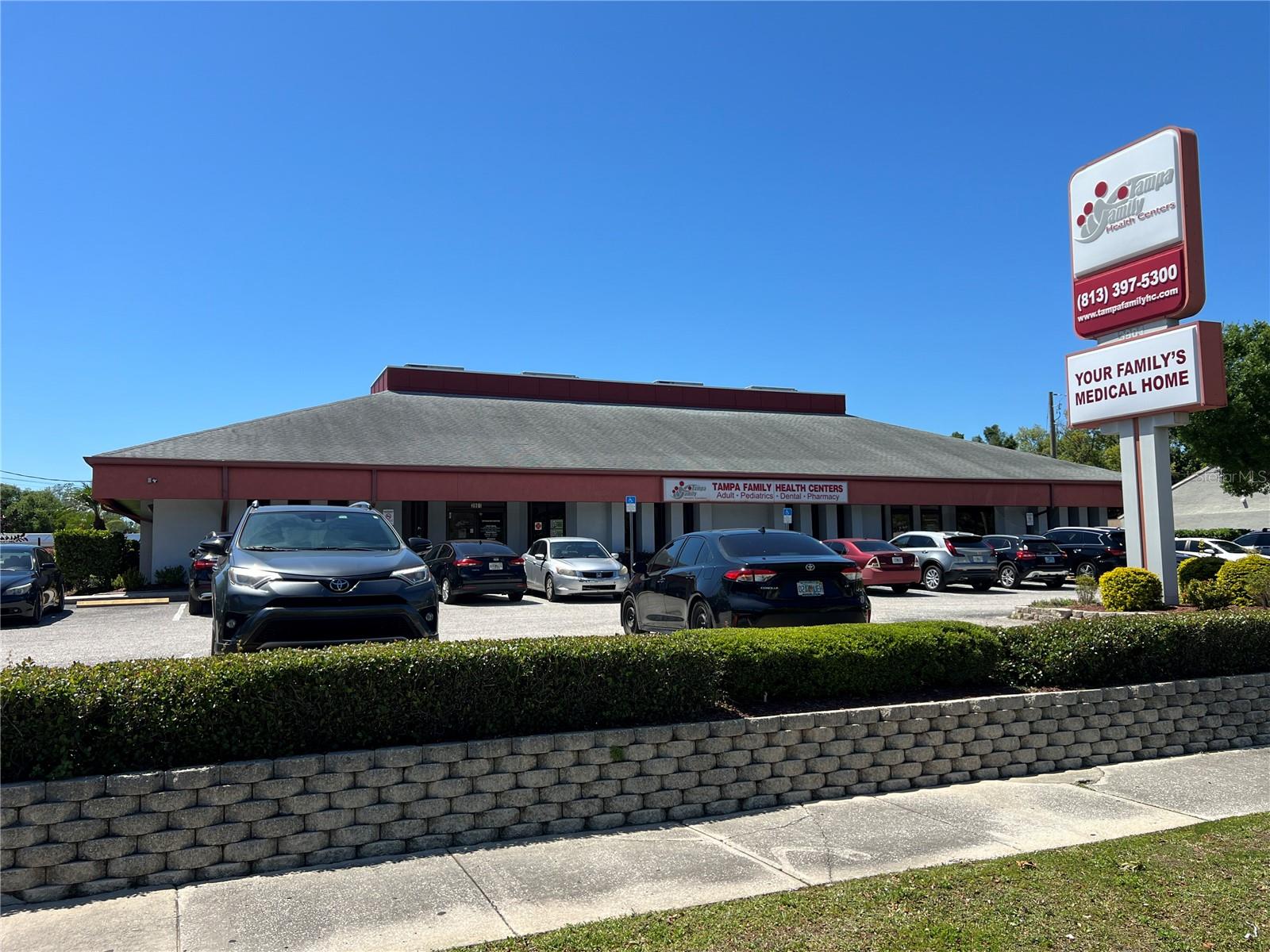 This South Tampa medical office is a rare find and is situated on a 30,000 SF CG zoned lot in the thriving South West Shore market. The site was originally designed as a bank site with external drive through and was purchased and redeveloped by Tampa Family Health Centers. The original external drive through (1,008 SF) was converted to a freestanding pharmacy while the main building (6,470 SF) functions as a multiple special medical facility which can be easily divided into 3 spaces. The left side (currently TFHC Women’s Care) has a 5 to 6 person private waiting room, 7 exam rooms, private physician's office, electrical and storage room, 3 station nursing/staff island, and 2 management and administrator offices. The middle space (TFHC Clinic) interconnects with the left side and has a 26 person waiting room, 2 ADA lobby restrooms, triage room next to reception desk, 4 station staff reception desk with adjacent managerial office and adjacent check out window office, internal billing office, supply closet, lab, lab restroom, 3 additional exam rooms, large 8 person break room with cabinetry and vending, and locker room area. The right side (TFHC Dental) also connects within the main buildings, yet has a private entryway and reception desk with 6 seat waiting area and adjacent triage or admin office, 2 station reception office, private practitioner office, 4 dental exam bays, central lab, standing x-ray room, pump equipment, and electrical room. This is a truly unique opportunity for a multi-practice medical facility, concierge practice, or investor who could subdivide the space to 4 units.

Located south of I-275 and north of the Selmon offering easy access to surrounding areas.