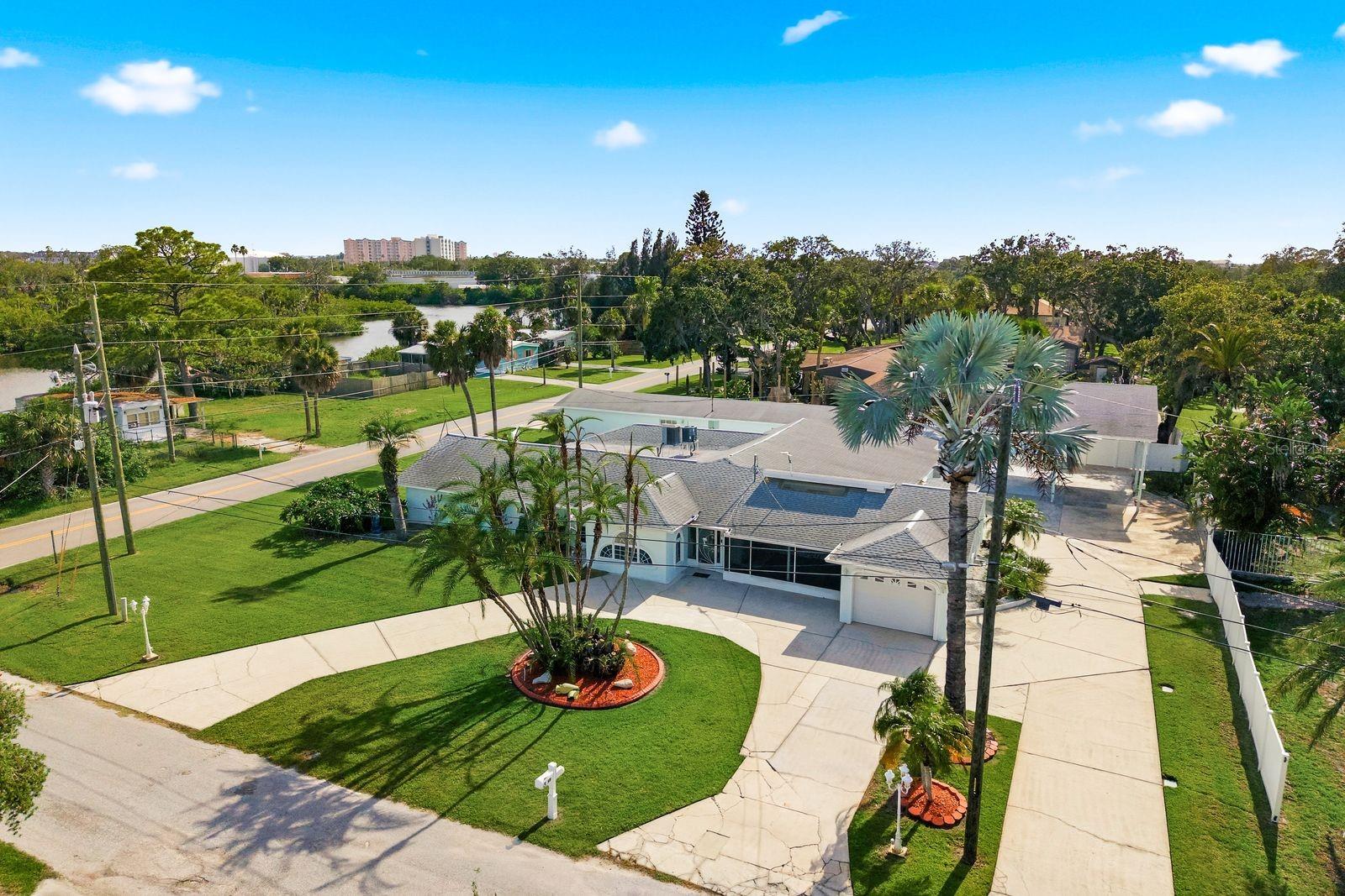 YOU MUST SEE IT TO BELIEVE IT! This is truly a one-of-a-kind property in the heart of New Port Richey! Extensively renovated, this estate offers an incredible blend of residential comfort, entertaining space, and unmatched flexibility. Situated on a prominent corner lot with access from both Main Street and Werner Avenue, this unique property presents endless possibilities for the visionary buyer. Designed for gathering and celebration, the property features a spacious dance hall complete with a disco ball, a dressing room, multiple flex spaces, and two fully equipped kitchens ready to accommodate everything from large family events to creative culinary pursuits. The current owners have lovingly used the property as a place to bring people together, creating lasting memories in its expansive and welcoming spaces.
Beyond the 3-bedroom, 3.5-bathroom residence, you'll discover additional rooms ideal for a media studio, podcast room, home office, music room, hobby space, or private retreat. Storage is abundant throughout, providing exceptional functionality rarely found in properties of this size and character. Outside, the opportunities continue with two massive detached garages offering space for workshops, collections, equipment storage, creative studios, or future customization. Covered RV parking, a circular driveway, and multiple points of access make the property as practical as it is impressive. With recent renovations throughout and a layout that inspires imagination, this remarkable property may appeal to buyers seeking space for multi-generational living, hobby-based businesses, educational activities, wellness pursuits, creative ventures, event hosting, or other uses subject to local zoning and approval requirements. Whether you're searching for an extraordinary residence, a live-work opportunity, or a property with room to dream big, this New Port Richey gem is unlike anything else on the market. Conveniently located near historical downtown New Port Richey where you can enjoy quaint shops, restaurants, parks, & boat ramp. Just minutes from medical facilities, schools, beaches, and Tampa International Airport!