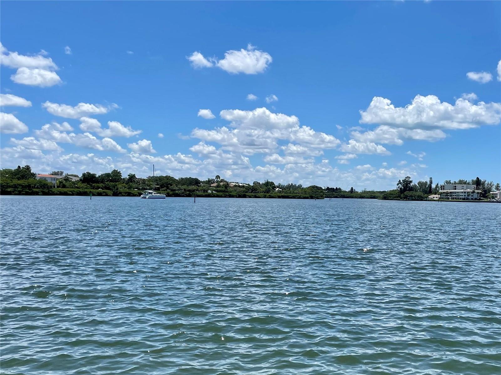 ON THE WATER - SPECTACULAR VIEWS:  This lot sits directly on the marina seawall, in Gulfshore, and has extended views of Sarasota Bay.  When a new elevated home is placed on this parcel of land, the views will only become more impressive.  There are contractors ready for you to design your interior layout and they will build your home to meet all FEMA building codes.  
The community of Gulfshore, is truly a tropical paradise and is just six miles from world-famous St. Armands Circle in Sarasota.  It offers ownership of approximately 450 feet of private beach on the beautiful Gulf of Mexico.  The Gulf is known for its wonderful sand beaches and turquoise waters.  In addition, Gulfshore has a marina on Sarasota Bay (docks currently being rebuilt), a kayak lift,  a large community swimming pool, and a clubhouse with a great kitchen for hosting social events.  Gulfshore is proud of their financial management and the affordable cost of living that has resulted.  
Gulfshore is a 55+ community that does not allow rentals or pets. Please call and schedule your personal showing and review possibilities for building your new home in paradise