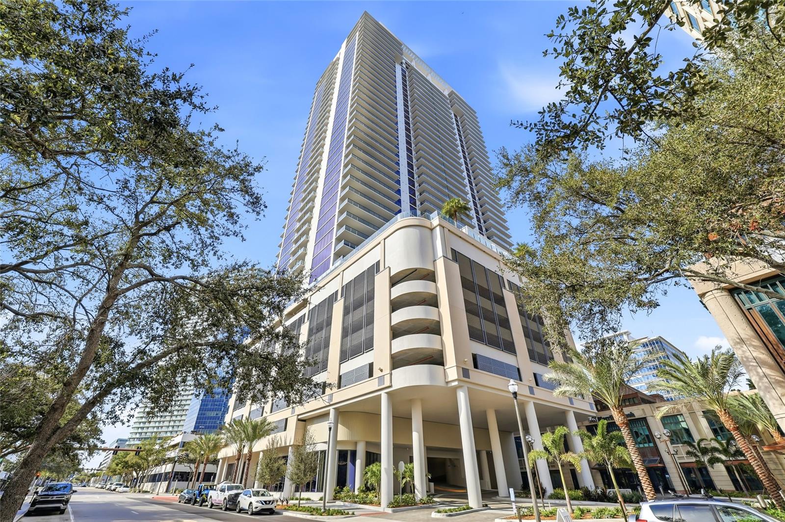 One or more photo(s) has been virtually staged. Experience elevated downtown living at Art House – Residence 1104, a brand-new high-rise home in the heart of St. Petersburg. Perched on the 11th floor, this coveted Dali residence offers views of Tampa Bay, the marina, and the city skyline, paired with refined modern design throughout. The open-concept living space is wrapped in floor-to-ceiling glass with 10 foot ceilings. The chef’s kitchen features premium quartz countertops and sleek JennAir stainless-steel appliances—ideal for both everyday living and entertaining. A rare highlight of this residence is the enclosed den, professionally finished with proper ventilation. This versatile space functions perfectly as a private office, guest room, fitness area, or creative studio, offering flexibility tailored to today’s lifestyles. The spacious primary suite boasts a spa-inspired bathroom, and a generous walk-in closet. Additional features include in-unit laundry and high-end finishes throughout. Residents enjoy access to Cloud 9, the resort-style amenities deck on the 9th floor, offering a pool and sundeck, a 4,200-square-foot state-of-the-art fitness center with private studios, sauna and steam rooms, golf simulator, billiards lounge, social lounges with private dining space, reservable spa treatment rooms, and a 20-seat private theater. Additional amenities include a 3,000-square-foot covered turf dog park, two guest suites, conference and co-working spaces, secure parking, valet service, and front desk concierge. Step outside your door to immerse yourself in the vibrant dining, arts, and waterfront lifestyle that makes Downtown St. Petersburg one of Florida’s most desirable urban destinations.