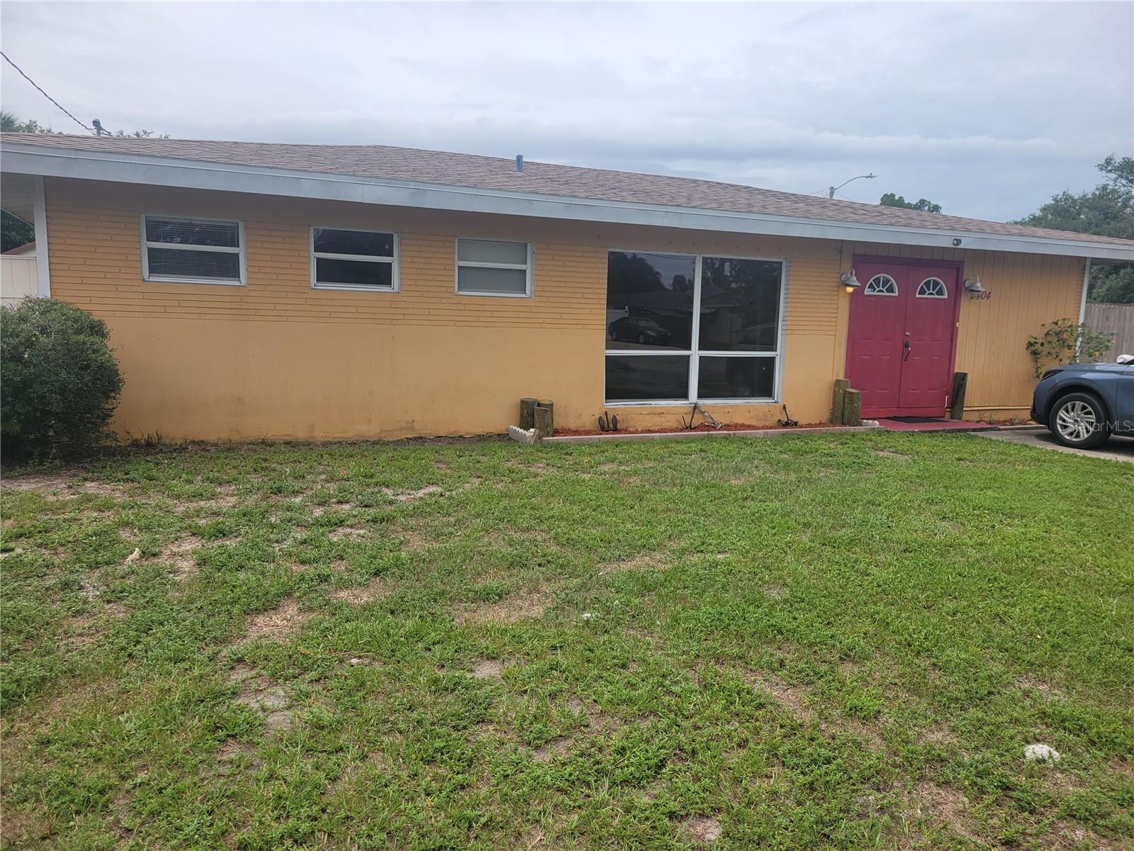 This fantastically clean, split-floor plan home offers a 5-year old roof (new in 2021), a newer AC (2018), and a fresh coat of paint throughout the interior. The entire home features ceramic tile flooring. No carpets to clean. The kitchen is updated with wood cabinets and a granite countertop. The primary bedroom is huge with a large walk-through closet. A corner lot, this property features a spacious, fenced backyard and a large carport accessible from the street through a wide, opening gate. Plenty of room to park multiple cars or work trucks, boats, and more. It is conveniently located three blocks from Lockwood Ridge Road near 17th Ave. Downtown Sarasota is 10 minutes away. Lido Beach is a quick 20-minute drive. NO HOA. NO DEED RESTRICTIONS. EXCELLENT RENTAL OPPORTUNITY.