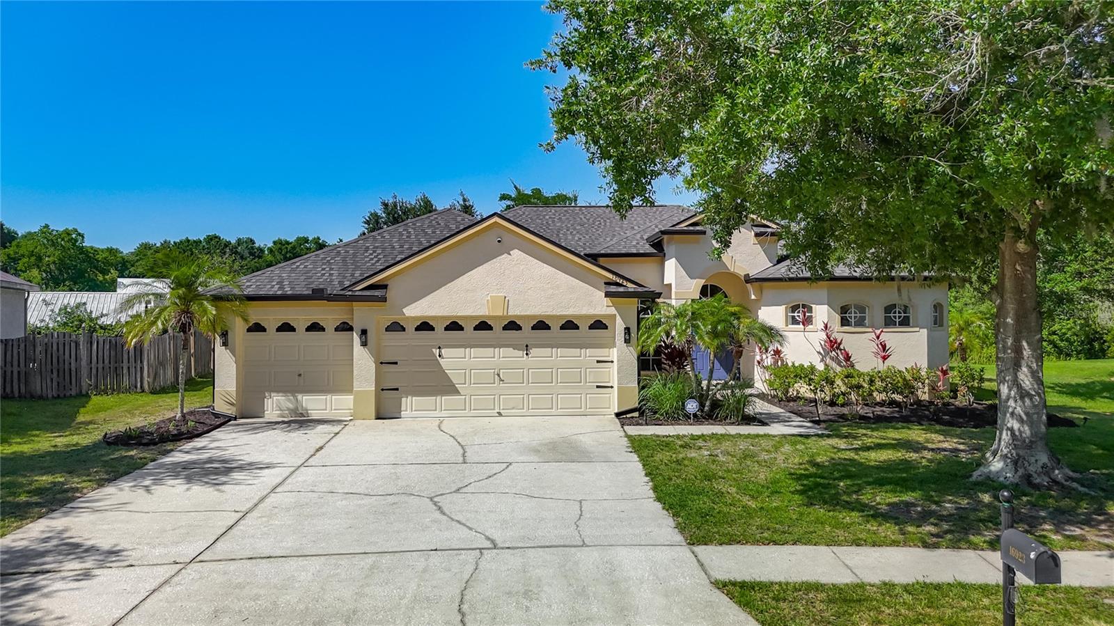 Beautifully updated and spacious 4-bedroom, 3-bath home located in the highly desirable Lakeshore Estates community. Surrounded by conservation lots and natural beauty, this home offers a peaceful setting with easy access to the Northdale Lake Park Trailhead and Lake Park. No CDD and remarkably low annual HOA fees - a rare combination. From the moment you walk in, you'll notice the bright and open feel of this 2,322 sq. ft. home. The functional layout features high ceilings, abundant natural light, new LED recessed lighting, new fixtures, and luxury vinyl plank flooring throughout. The open 3-way split floor plan offers excellent flow, privacy, and flexibility. The spacious kitchen features quartz countertops, a designer backsplash, soft-close cabinets, a generous island, updated appliances, an oversized sink, a water filtration system, and an optional gas hookup for the range. The primary suite includes his and hers closets, patio access, dual vanities, a walk-in shower, a relaxing soaking tub, and a retreat atmosphere that feels like a luxury resort. All three bathrooms have been fully renovated. Major updates include a new roof (2023), new gutters (2025), gas water heater (2024), a heat/cool smart thermostat, updated fixtures, a full ADT smart home alarm system, and much more. The 3-car garage provides ample space for vehicles and storage, with an original Tesla Wall Connector installed. Large sliding glass doors open to a screened and tiled porch overlooking a deep, oversized backyard with no rear neighbors - just peaceful green views. Conveniently located near highly regarded schools, this home is truly move-in ready and offers the lifestyle and convenience today's buyers are looking for. Want a truly turnkey option? All furniture is available for purchase - move in with nothing but your suitcase. This home delivers comfort, privacy, nature, and convenience, with easy access to Veterans Expressway and Dale Mabry. Schedule your showing today and experience everything this home and its incredible location have to offer.