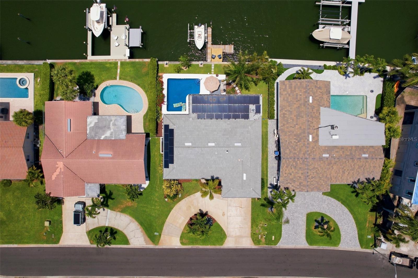 Rather than putting on layers of winter gear and braving the biting cold, wake up in paradise, in your completely remodeled and fully furnished, Florida. waterfront home. You begin your day with breakfast on your private dock, with a watchful eye for dolphin, manatee, and our neighborhood Great Blue Heron, which frequent the sparkling water basin on which your home resides. By afternoon, you are on your boat, launched from your private boat lift, and in Tampa Bay, kayaking and paddleboarding in Weedon Island Preserve, floating in your pool just feet from the water’s edge, reading a book under the palms, taking care of life from your water front sunroom/office, out and about in gorgeous downtown St. Pete, or at any one of the many magnificent beaches, all just minutes from your dock or door step. By evening you are taking in the magnificent sunsets, grilling, sitting by the fire, and watching the stars, from your waterfront pool/patio deck, or out on the town at one of St. Pete’s award-winning restaurants and famous St. Pete Pier. This is your life in Venetian Isles, a quiet, residential hamlet, and one of St. Petersburg’s most sought after water-front communities.

The Residence
3-bedroom, 2 ensuite baths, 2,200 sq. ft., contemporary furnished, move-in-ready open living space. The sparkling new kitchen features quartz countertops, stainless steel appliances and coffee bar. The open concept living room and dining room, with floor to ceiling glass sliding doors, open-up to your private, waterfront, pool deck. The primary suite offers a king-size bed, walk-in closet, and spa shower ensuite. The additional two bedrooms, located on the opposite side of the home, one of which has a private ensuite, are each tastefully appointed with a queen bed, closet, dresser and television. All you need to bring are your toothbrush, clothes, car and boat.

The Location
Venetian Isles is minutes away from everything that makes St. Pete one of the most desirable cities in Florida: downtown’s restaurants, galleries, festivals and parks, and only 35 minutes from Tampa International Airport. St. Pete is famous for its world-class museums, stunning Gulf Coast beaches and vibrant arts scene. Known as the “Sunshine City” for holding a world record of 768 consecutive days of sunshine, it perfectly blends outdoor relaxation with a rich cultural hub.   All maintenance and utilities are included right down to the pool floats.  All that is needed is you.
