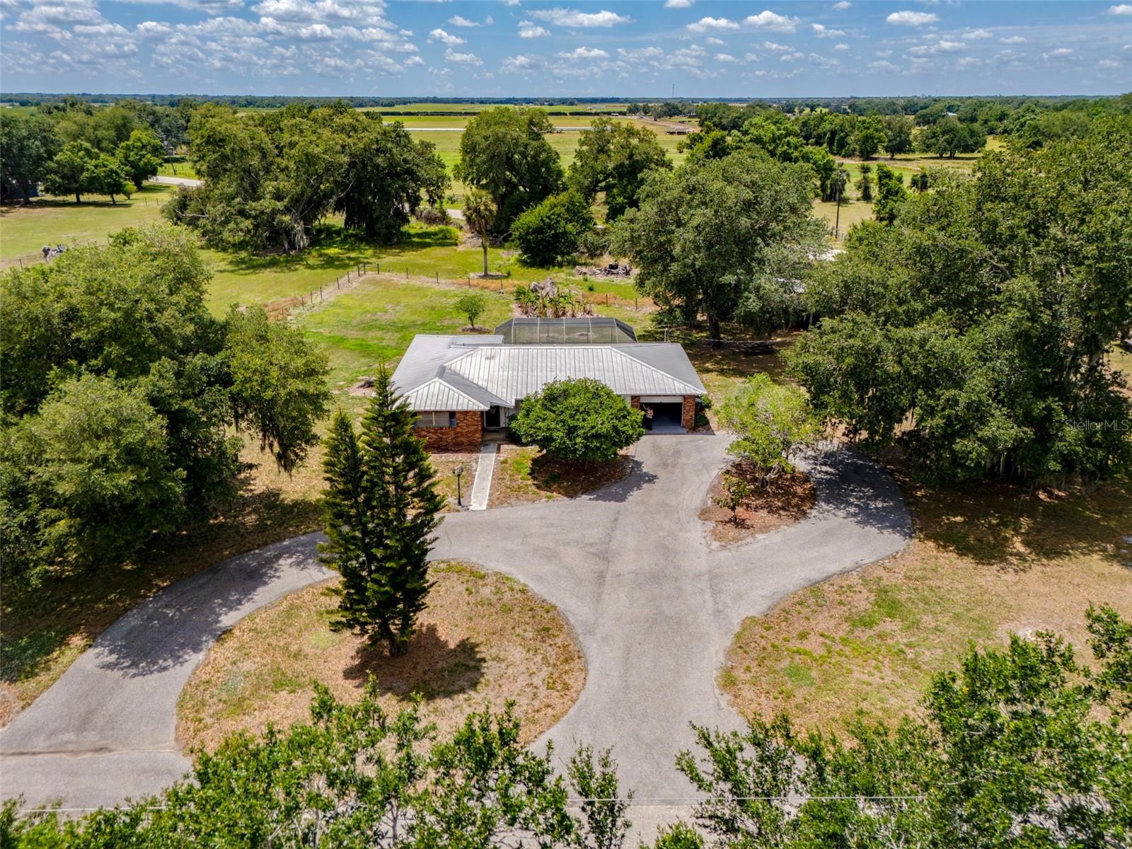 Welcome to your private countryside retreat, where timeless charm meets everyday comfort. This beautiful brick home offers three spacious bedrooms and two well-appointed bathrooms, perfectly designed for both relaxation and entertaining.
Step outside and discover your own personal oasis—a heated saltwater pool that invites year-round enjoyment, surrounded by peaceful views and the serenity only nature can provide. The property is shaded by a stunning canopy of mature oak trees, covered with the scent of gardenias and graced with guavas.
With five expansive acres, there’s endless room to roam, play, and bring your vision to life—whether that’s gardening, recreation, or simply enjoying the wide-open space. Ample storage throughout the property ensures there’s a place for everything, from tools to toys.
Tucked away in the quiet of the countryside, this home offers the best of both worlds: tranquil, private living just 10 minutes from downtown Arcadia, giving you convenient access to shopping, dining, and everyday essentials.

-This is more than a home—it’s a lifestyle of space, beauty, and peaceful living
