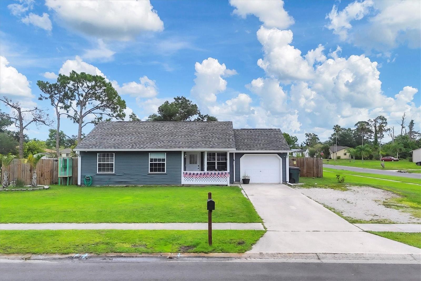 This charming 2-bedroom, 1-bath home is perfectly situated on a desirable corner lot in one of North Port’s most convenient neighborhoods. Just minutes from shopping and with easy highway access, this home offers both comfort and convenience. Featuring a brand-new 2024 roof, a new A/C system with UV light, and storm-ready hurricane shutters, it’s designed for peace of mind. The low-maintenance vinyl flooring enhances the home, while the updated kitchen boasts new cabinetry, stylish countertops, and newer appliances. A converted garage bonus room under air adds extra living space, perfect as a home office, studio, or guest retreat. Outside, the fully fenced backyard is ideal for pets, children, or hosting weekend barbecues. Enjoy your own array of fruit trees, including moringa, mulberry, blackberry, lime, Barbados cherry, pomegranate, fig, loquat, elderberry, dragon fruit, and Jujube. Plus, with numerous parks/playgrounds, a marina down the street for your boating adventures, shopping, and dining options nearby, you’ll have everything you need!