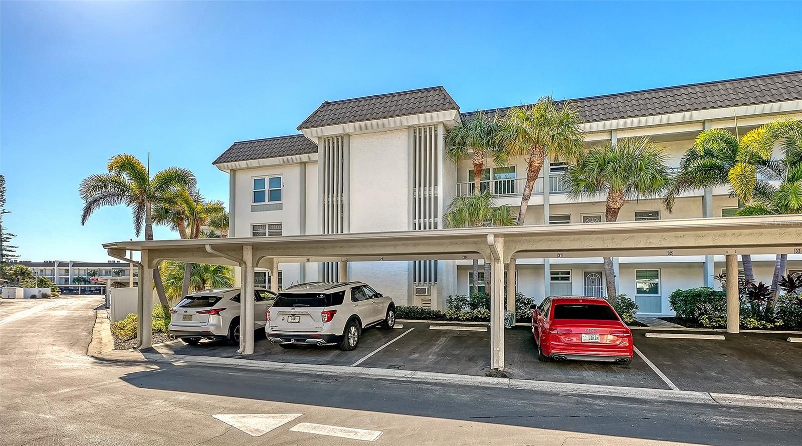 Investor alert. Great investment opportunity! Condominium is in great condition. Best price for two-bedroom, two-bath condominium in sought after community of Longboat Harbour. Motivated sellers, ready to have a new buyer enjoy this lovely waterfront first-floor end-unit condominium. New roof, all assessments paid, granite countertops, kitchen open to living area. All glass lanai, tile throughout main living, carpet in bedrooms were in the bedrooms but carpet removed for new flooring to be installed. A huge plus: end unit, close to the beach, washer and dryer are in the unit. Hurricane shutters on rear of unit. Additionally, the beautifully renovated recreation room overlooking the bay serves as heart of social gatherings in Longboat Harbour, hosting a variety of clubs and activities complemented by a kitchen and dance floor. The four heated swimming pools provide relaxation and enjoyment year-round. For beach lovers, a community beach pavilion across Gulf of Mexico Drive offers residents private, private deeded beach access with a cabana, parking, restrooms and dressing areas. Witness breathtaking sunrises, spot manatees and savor stunning sunsets along the Gulf beach. This exceptional opportunity offers an unparalleled lifestyle in one of Longboat Key's active, social and vibrant communities! Seize the opportunity to experience waterfront living at its finest. This condominium community was not impacted by hurricane flood waters, according to the owner. Make this beautiful community your next home!