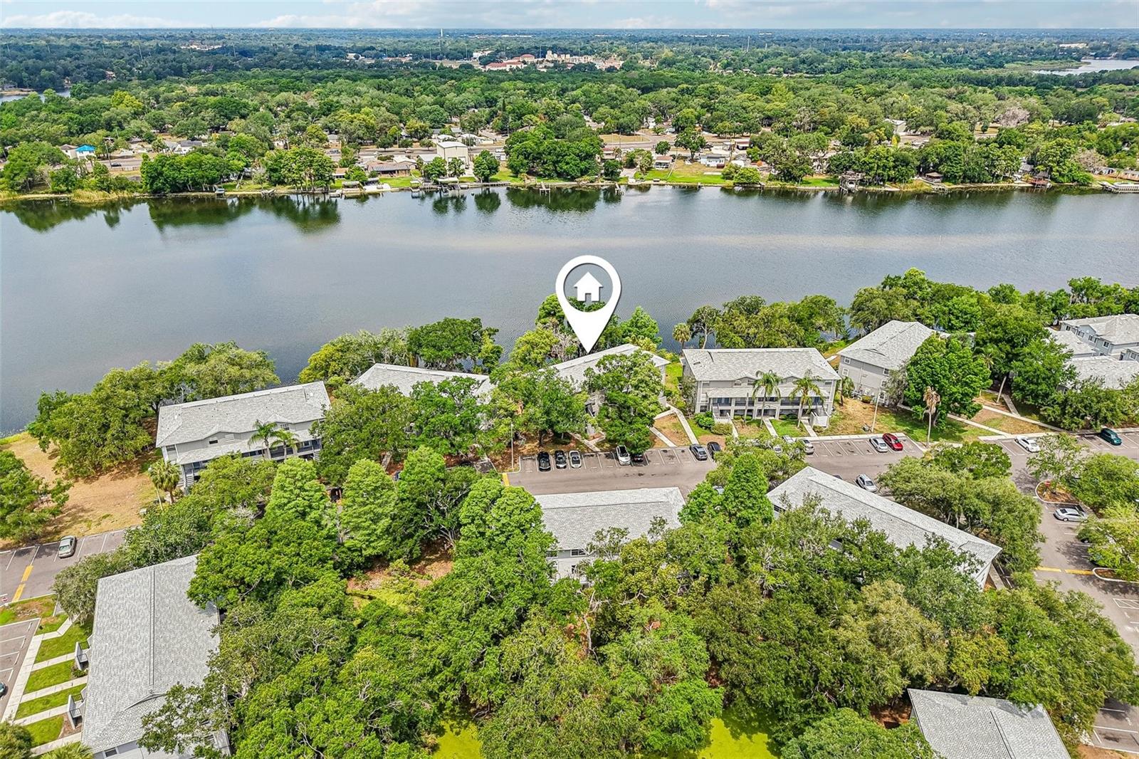 Experience tranquil, riverside living in this beautifully fully renovated 2-bedroom, 1.5-bathroom condo within the gated Waterside Community. This second-floor, two-story unit overlooks the serene Hillsborough River, and with no neighbors above you, the home offers exceptional privacy and a peaceful atmosphere. As you enter, you’re welcomed by a dining area with breakfast bar that flows seamlessly into the stunning updated kitchen, complete with modern finishes. The bright living room showcases a large window framing calming river views, creating a relaxing backdrop to your everyday life. Upstairs features two spacious bedrooms, one having washer and dryer hookups, and a fully renovated bathroom with stylish finishes and a soaking tub, while a convenient updated half bath is located downstairs for guests. This move-in-ready home has been thoughtfully renovated throughout and features new laminate flooring for a sleek, modern feel. Located in a secure, gated riverside community, this home offers the perfect blend of comfort, convenience, and waterfront living. Enjoy resort-style amenities including a sparkling pool, private boat ramp and dock for river adventures, and a playground. With exterior maintenance included, you can spend your weekends enjoying the river rather than worrying about upkeep. Embrace the waterfront breezes and relaxed lifestyle at Waterside, and don’t miss your opportunity to own this exceptional fully renovated riverside retreat!