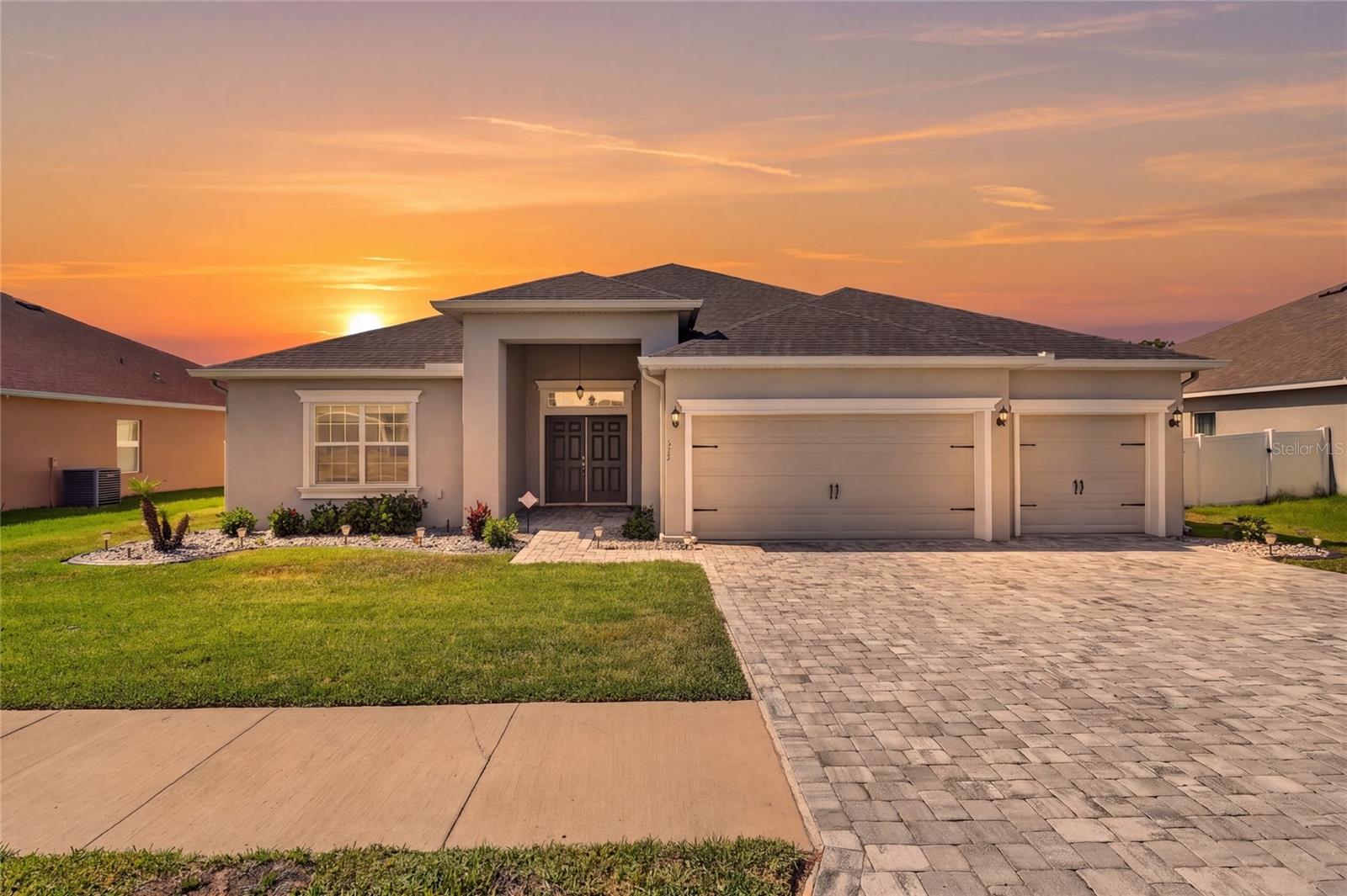 Welcome to this stunning move-in ready residence located in the highly desirable community of Juliana Village in Auburndale, where luxury, comfort, and thoughtful design come together effortlessly. Perfectly positioned on a premium lot with peaceful conservation views, this beautifully maintained home offers over 3,000 square feet of elegant living space designed to accommodate both everyday living and entertaining.
From the moment you enter, you are welcomed by an open and inviting floor plan filled with natural light and enhanced by tasteful finishes throughout. The spacious main living areas seamlessly connect the kitchen, dining, and family room, creating the perfect atmosphere for gathering with family and friends. Ceramic tile flooring throughout the main living spaces adds both beauty and durability, while custom-fit window blinds and upgraded details elevate the home’s overall appeal.
At the heart of the home is a beautifully appointed gourmet kitchen featuring elegant 42-inch cabinetry with crown molding, granite countertops, stainless steel appliances, a spacious pantry, and an oversized breakfast bar ideal for casual dining and entertaining alike.
Offering five spacious bedrooms and 3.5 bathrooms, this home provides room for everyone to enjoy comfort and privacy. The luxurious owner’s suite serves as a private retreat complete with a large walk-in closet, dual vanities, beautifully tiled shower, and a relaxing garden tub designed for unwinding at the end of the day. Additional bathrooms also feature upgraded tiled showers, adding a refined and modern touch throughout the home.
Upstairs, a versatile loft/bonus room with its own half bath and separate AC unit offers endless possibilities, whether used as a media room, home office, game room, fitness area, guest retreat, or additional lounge space tailored to your lifestyle.
Step outside and experience true Florida living from the covered and screened lanai overlooking the fully fenced backyard and serene conservation area. The outdoor space is ideal for entertaining, relaxing evenings, pets, or simply enjoying the privacy and tranquility this premium homesite provides.
Additional highlights include a spacious 3-car garage, radiant barrier attic insulation for enhanced energy efficiency, gutters, a paved driveway, architectural details, beautiful landscaping, and modern features that combine style with functionality.
Conveniently located just minutes from I-4, this exceptional property offers easy access to Orlando, Lakeland, shopping, dining, and world-famous attractions including Walt Disney World, while still maintaining the peaceful charm and convenience of Auburndale living.
This is more than just a home, it is a lifestyle of comfort, elegance, convenience, and space thoughtfully designed for the way you live today.